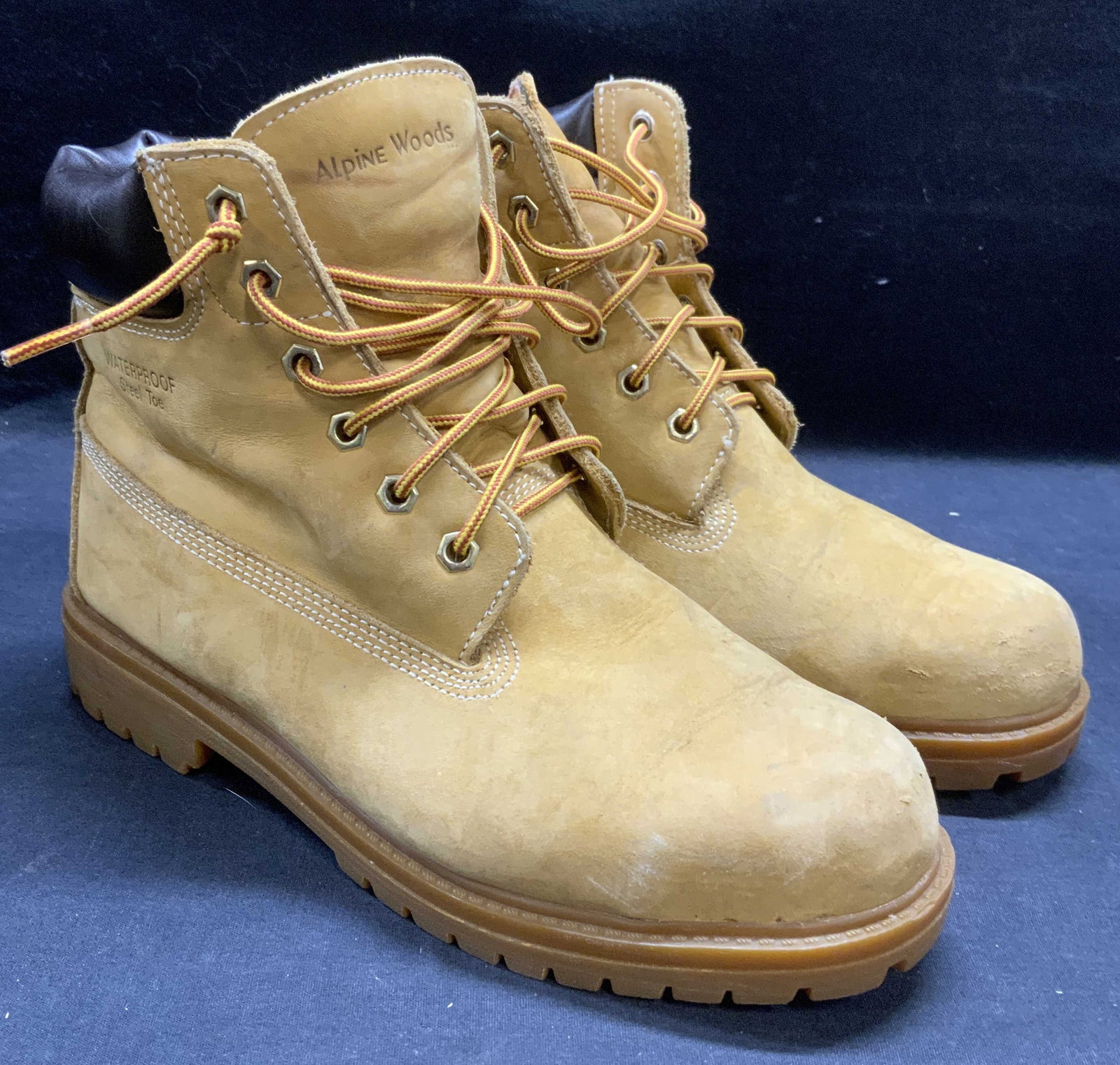 Alpine Woods Waterproof Steel Toe Boots: Alpine Woods tan leather waterproof steel toe boots. Size 8. Wear to material and soles consistent with exposure. alpine woods, alpine woods steel toe boots, mens designer boots, mens designer fashion