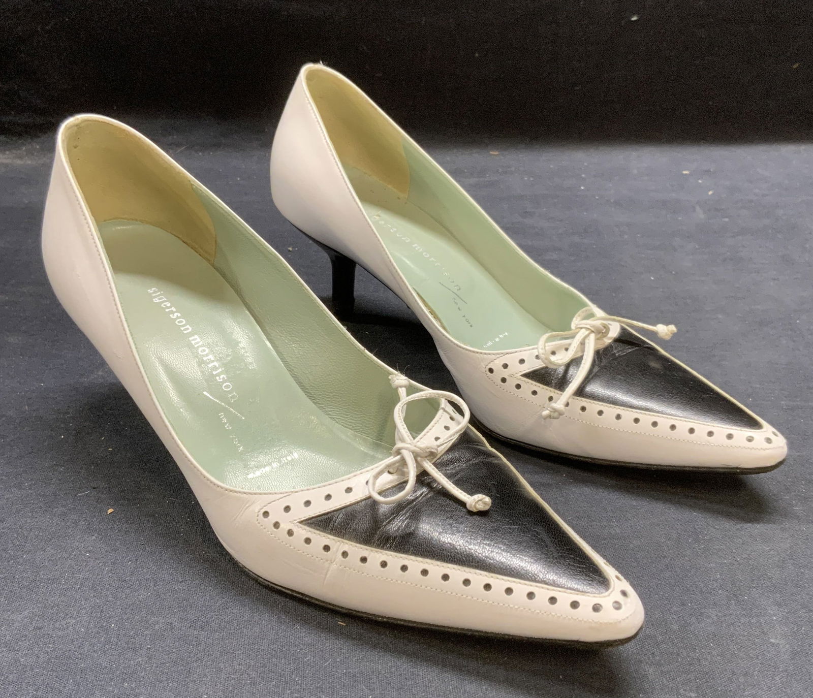 Sigerson Morrison Black/White Leather Heels, Italy: Sigerson Morrison black and white pointed toe leather heels with eyelet cutout detail. Size 6. Made in Italy. Some wear to leather and soles consistent with exposure. Sigerson Morrison, Sigerson Morri