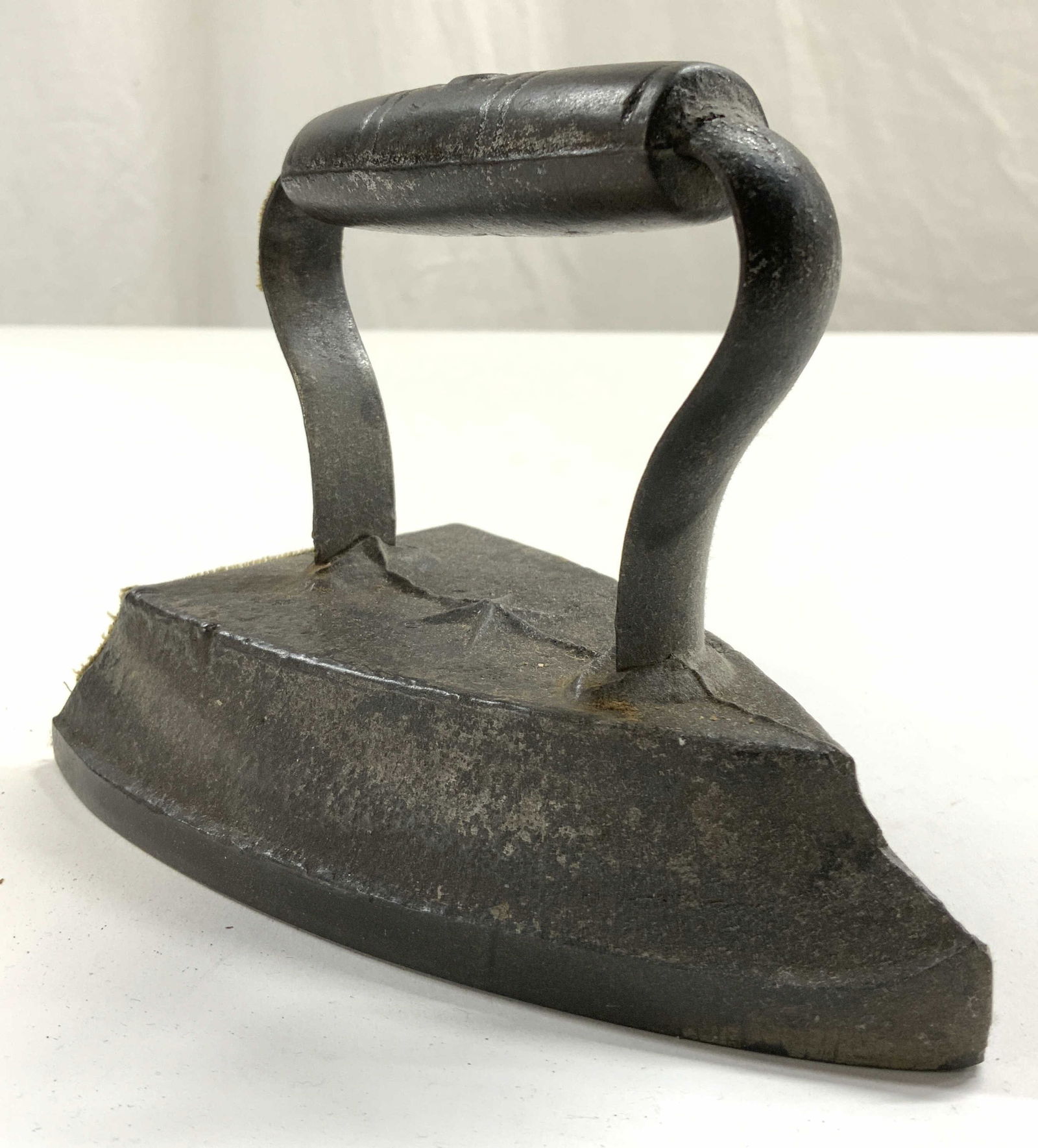 Antique Iron W Handle & Felt Backside: Top of handle reads 5. Iron appears to be antique possibly vintage. Piece is significantly weighted for size. Backside has green toned felt lining. Iron measures approximately 5.75 inches deep 4.5 inc