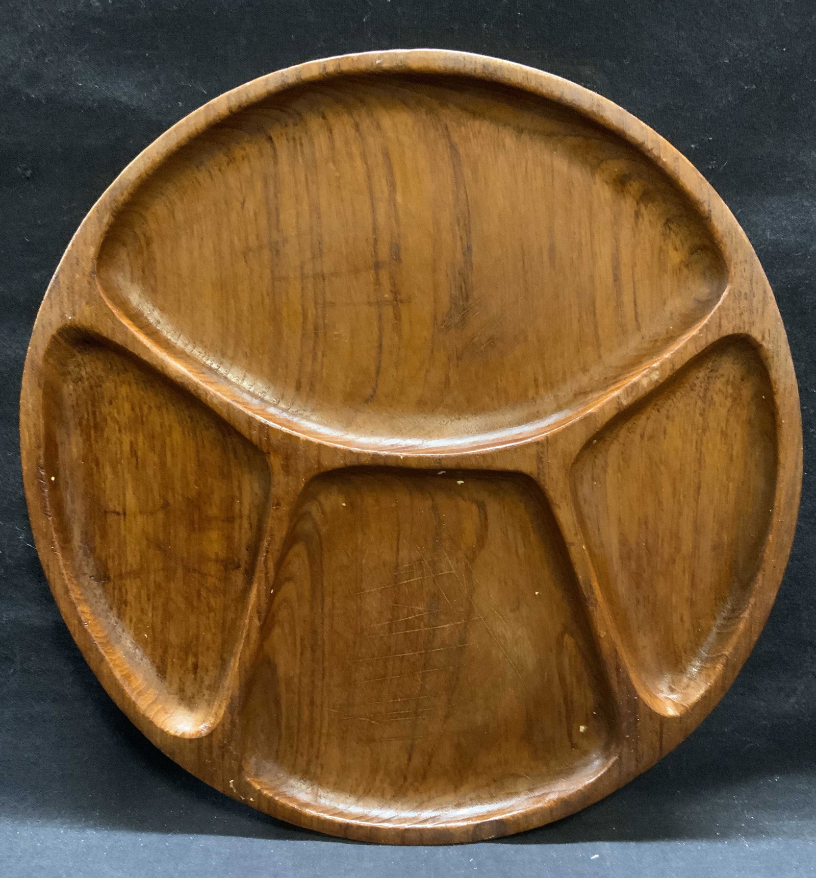 Vintage Round Wood Divided Platter: Vintage round shaped wooden divided platter. Measures approx. 11.75 inches diameter. Surface wear including scratching observed. Round platter, wood platter, divided platter, tableware, table accessor