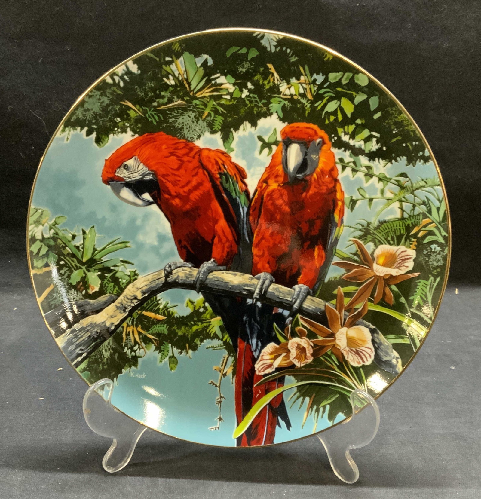 Royal Cornwall Scarlet Macaws Porc Plate 1981: Royal Cornwall porcelain plate The Exotic Birds of Tropique series. Scarlet Macaws by Konrad Hack. Issued 1981. Measures approx. 9.25 inches diameter. Trademarked and numbered to underside. Includes c