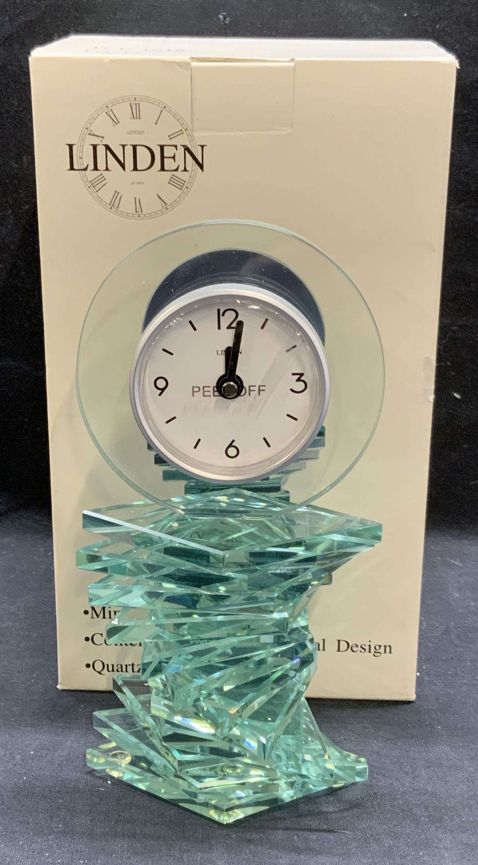 Linden Stacked Spiral Mineral Glass Clock NIB: Linden stacked spiral mineral glass clock. Quartz movement. Battery operated. Signed on clock face. piece has weight. New in box. Measures approx. 4 x 7.75 inches. Not tested for function. Linden, lin