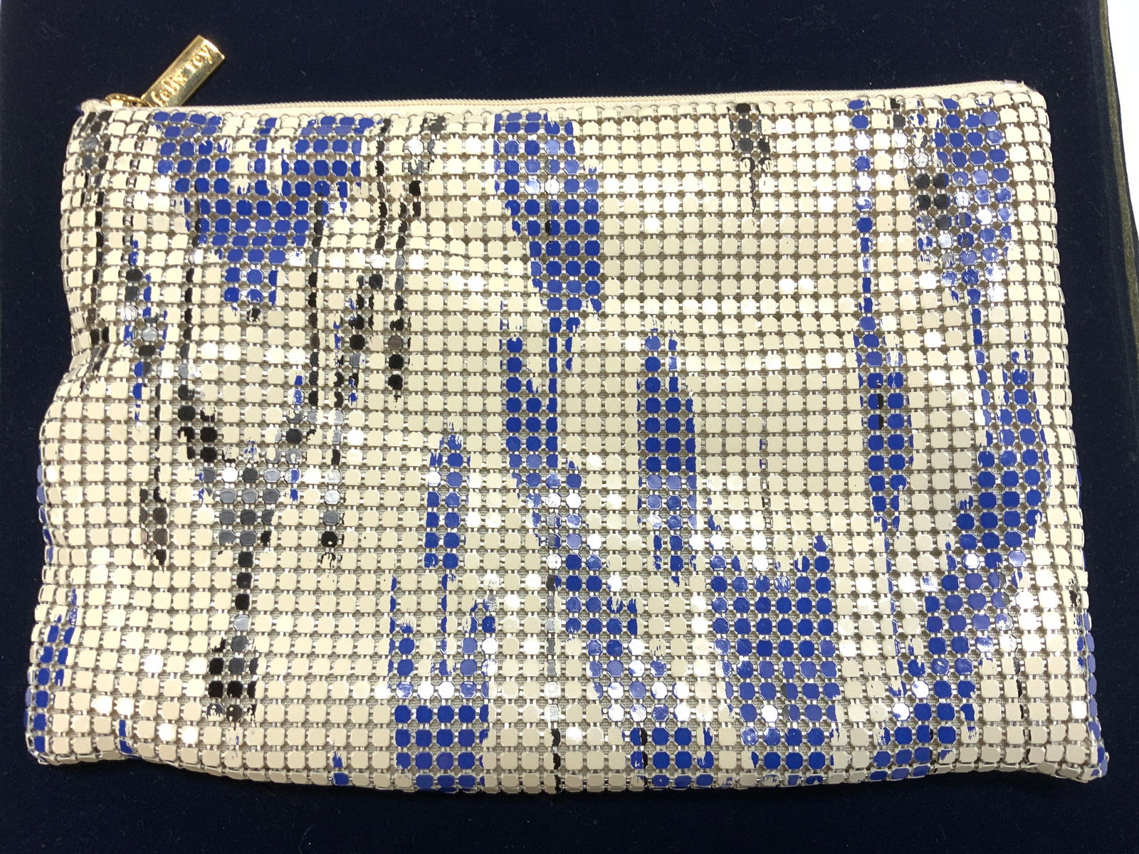 Felix Rey Zippered Enamel Mesh Evening Clutch: Padded zippered clutch , blue, block and white abstract design on metal mesh. Interior hallmarked Felix Rey New York and lined with ribbed royal blue fabric. Measures 9.5 x 6.5 in. Property of Manhatt