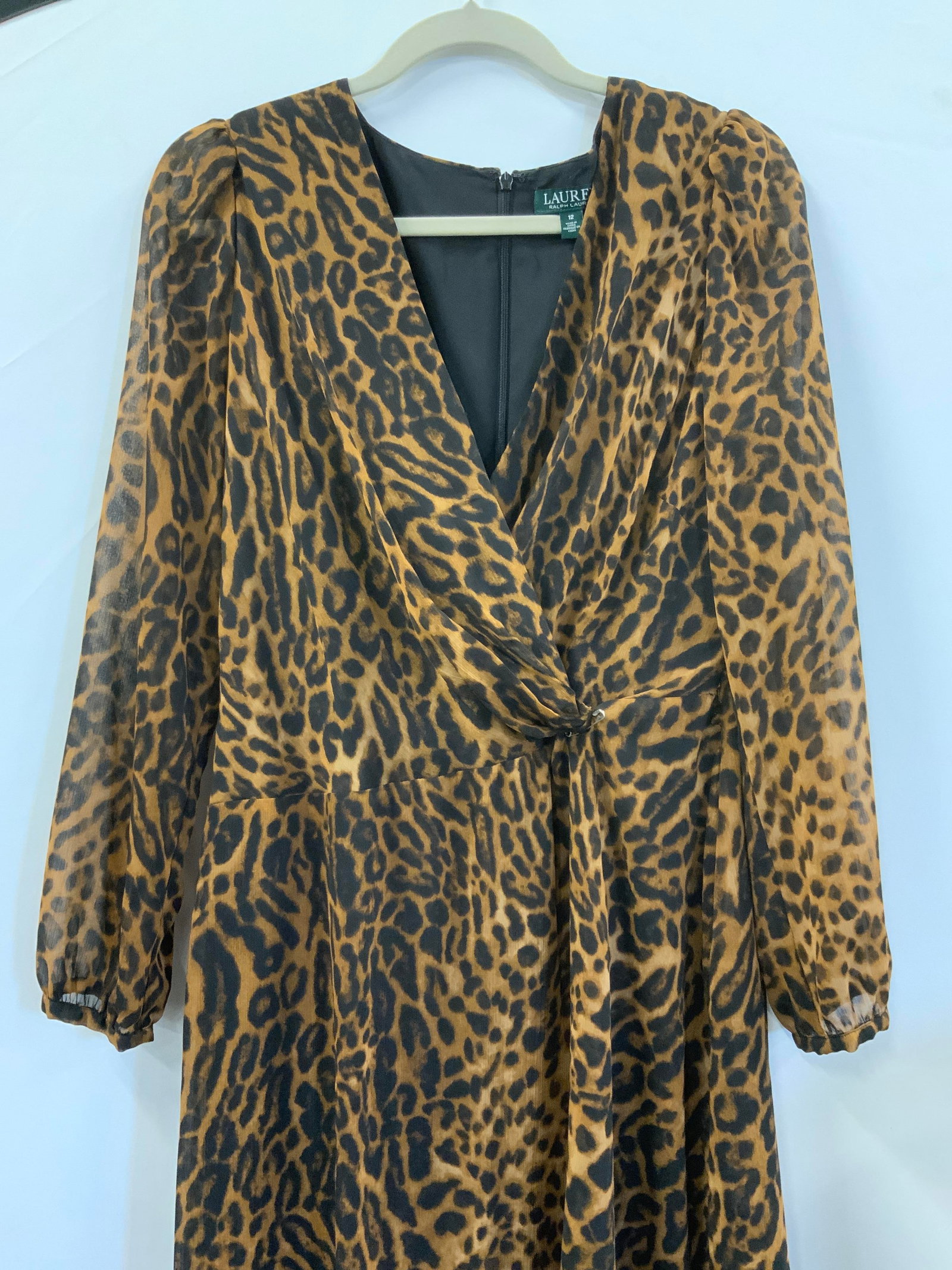 Ralph Lauren Animal Print Dress: Size 12 animal print long sleeve dress in brown and black . Ruched V collar. 50 in. Long. Belt detached / torn from waist but comes with dress. Polyester. Ralph Lauren Dress, Animal Print dress, casua