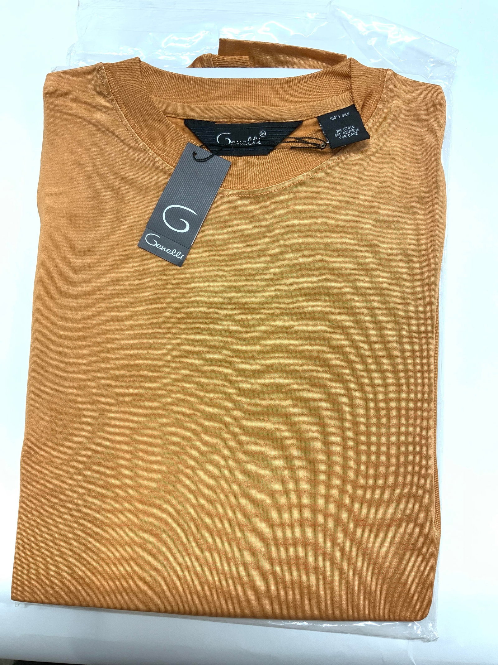 GENELLI ORANGE SILK CREW NECK SHIRT, NIP: Size Medium shirt sleeve GENELLI Shirt, all silk, muted pumpkin orange color. Crew neck. New in package with original tags. Possibly mens shirt. Unisex wear. Property of Manhattan Estate DuPont Heir. 