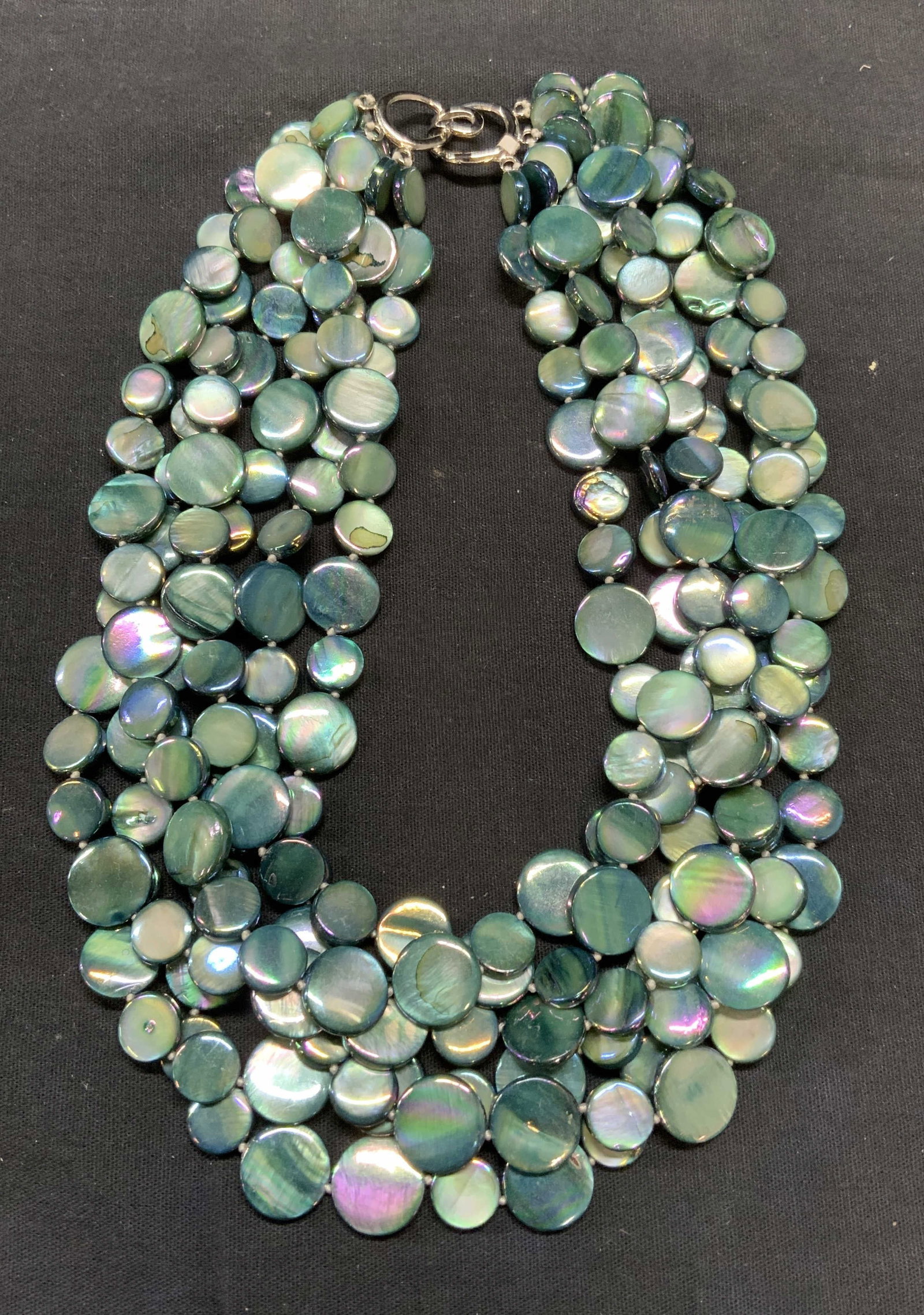 Blue Mother of Pearl Multi Strand Necklace: Blue mother of pearl beaded multi strand necklace. Drop length approx. 7 inches. Necklace has weight. Total weight 205.3 grams. Some scratching observed. Estate jewelry, costume jewelry, cocktail jewe