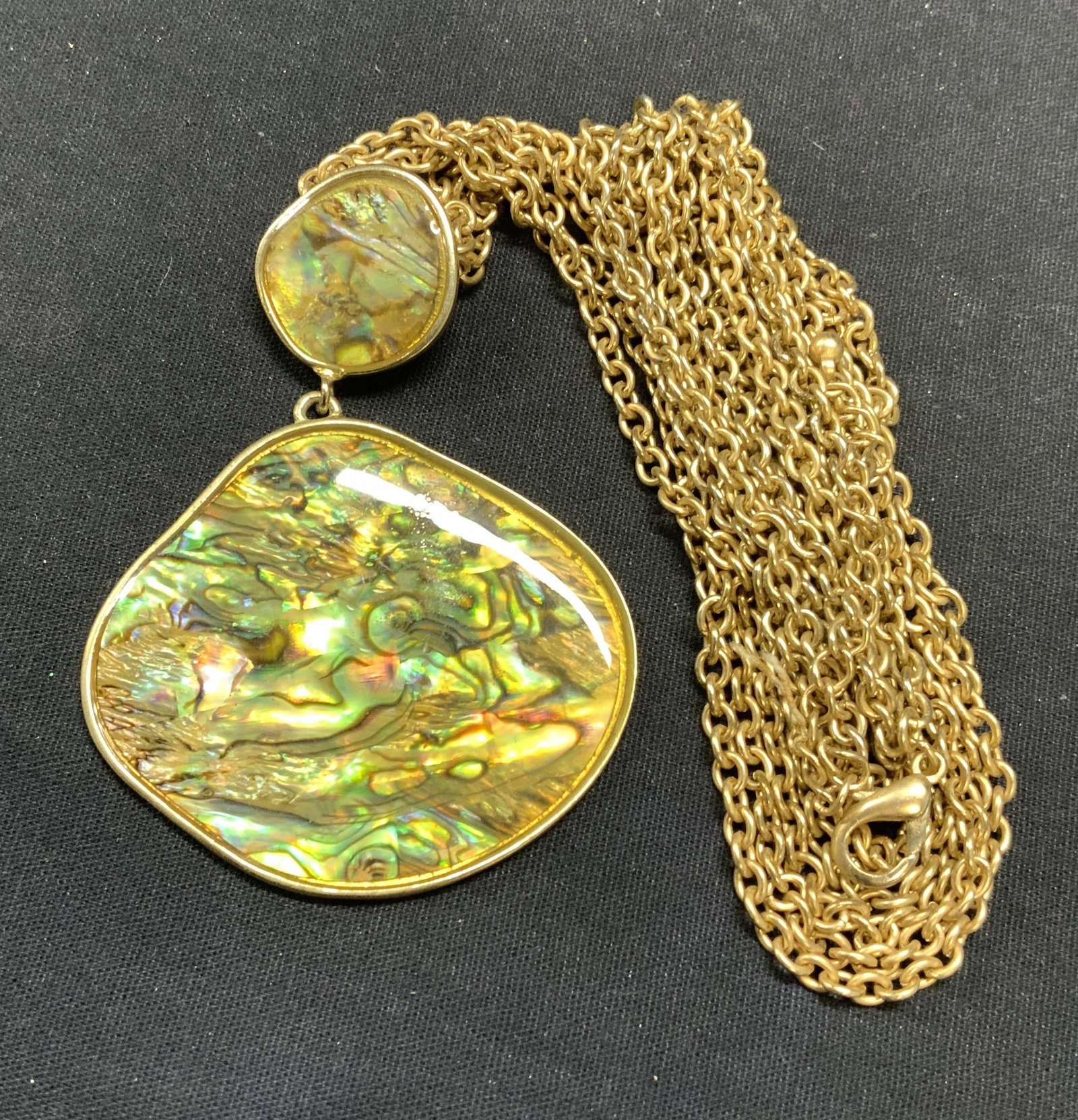 Gold Tone Abalone Style Pendant Necklace: Gold tone multi chain necklace with abalone shell style pendant. Drop length approx. 16 inches. Pendant measures approx. 3.25 inches long. Some scratching observed. Estate jewelry, costume jewelry, co