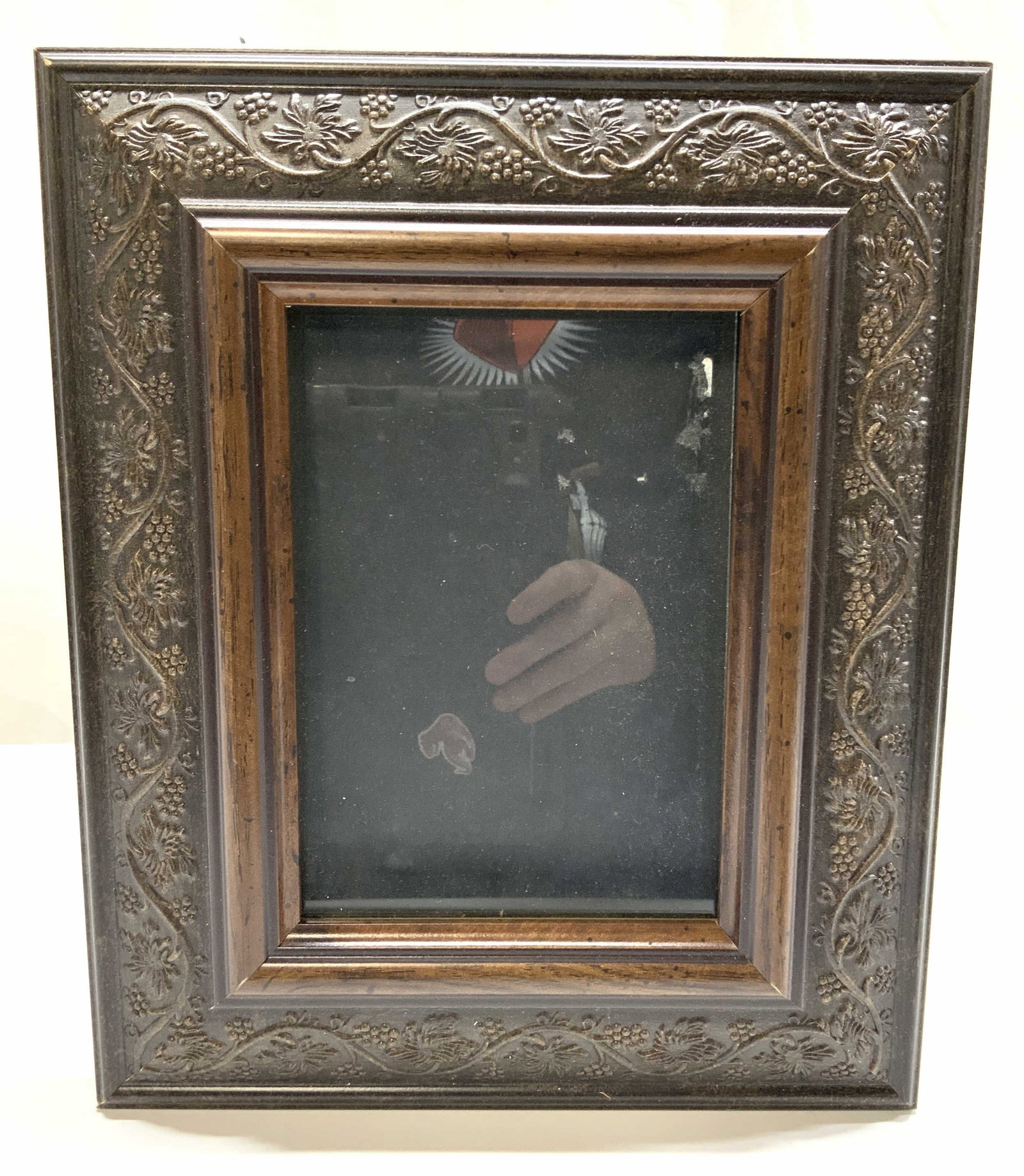 Floral Motif Wooden Picture Frame: Floral motif wooden picture frame with easel backing and glass center. Edges adorn with raised scroll floral motifs. Approx 11.75 x 9.75 inches window measures 6,75 x 4.5 inches. Moderate wearing to c