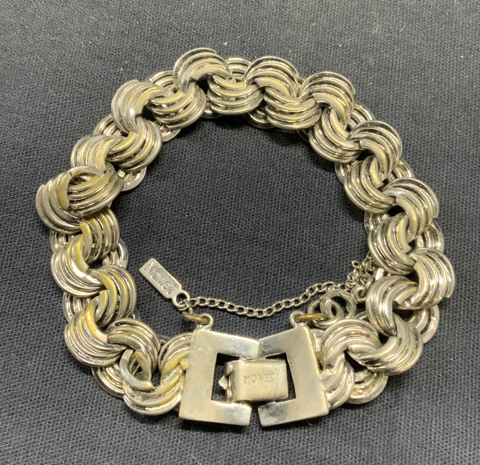 Vintage Monet Silver Tone Chain Bracelet: Vintage Monet silver tone chain bracelet. Signed on clasp and hang tag. Measures approx. 7 inches. Some scratching observed. Estate jewelry, costume jewelry, cocktail jewelry, fashion jewelry, accesso