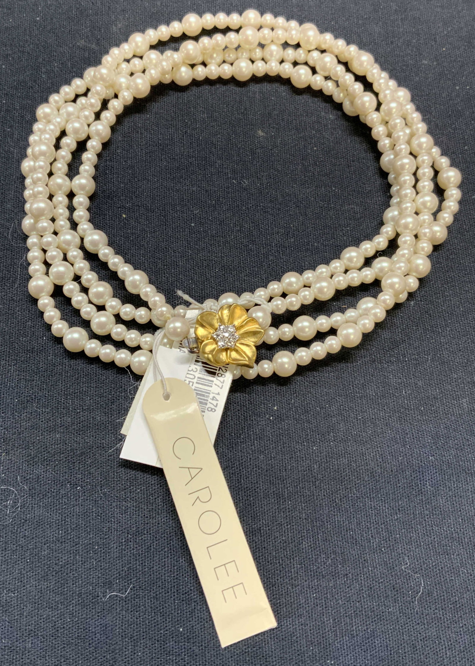 Carolee Faux Pearl Beaded Necklace NWT: Carolee faux pearl beaded necklace. Gold tone and crystal decorated flower clasp. Signed on clasp. Drop length approx. 23 inches. Some surface wear observed. Estate jewelry, costume jewelry, cocktail 