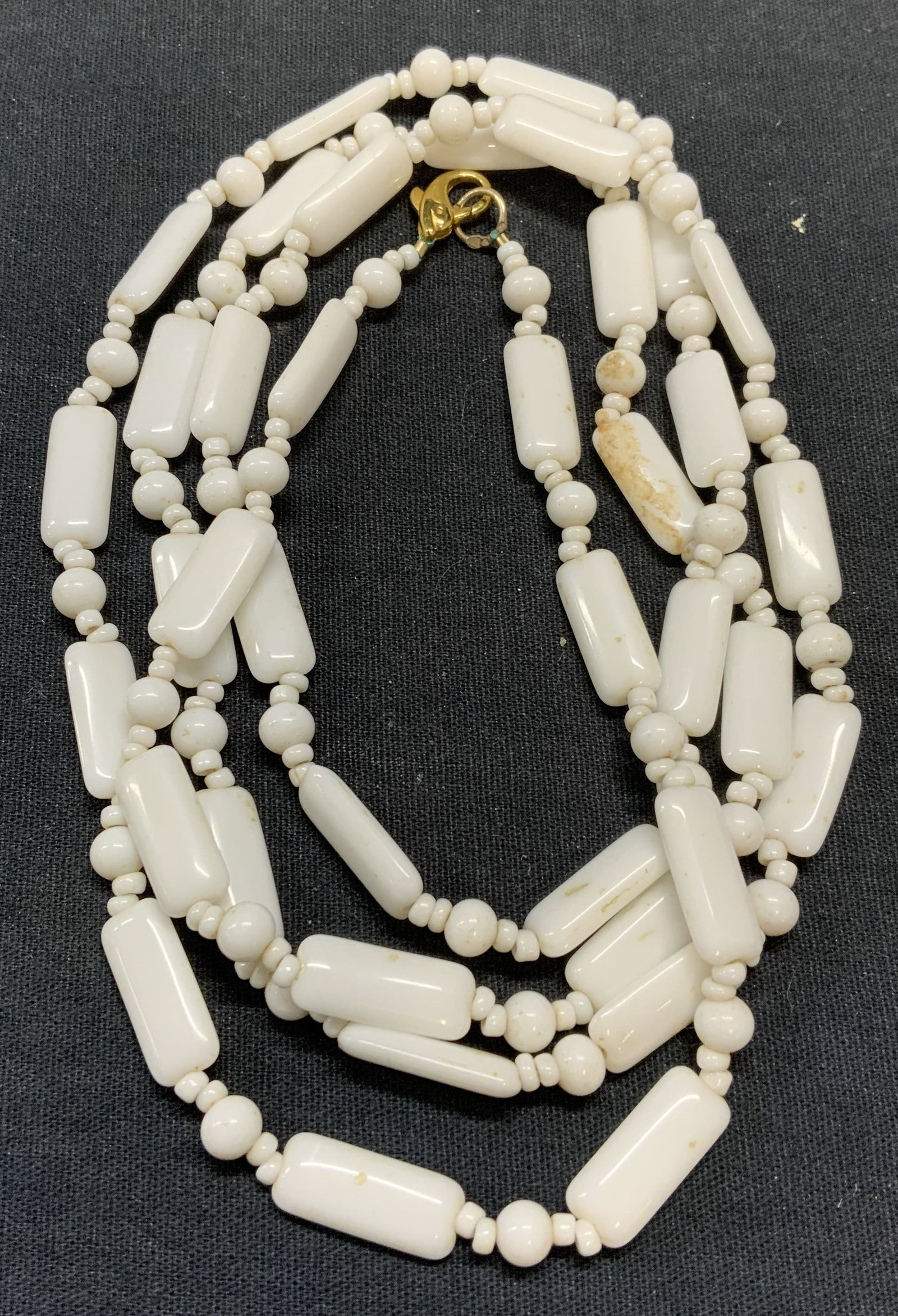 Vintage White Beaded Necklace: Vintage white beaded necklace with rectangular and round shaped beads. Drop length approx. 22 inches. Some scratching observed. Estate jewelry, costume jewelry, cocktail jewelry, fashion jewelry, acce