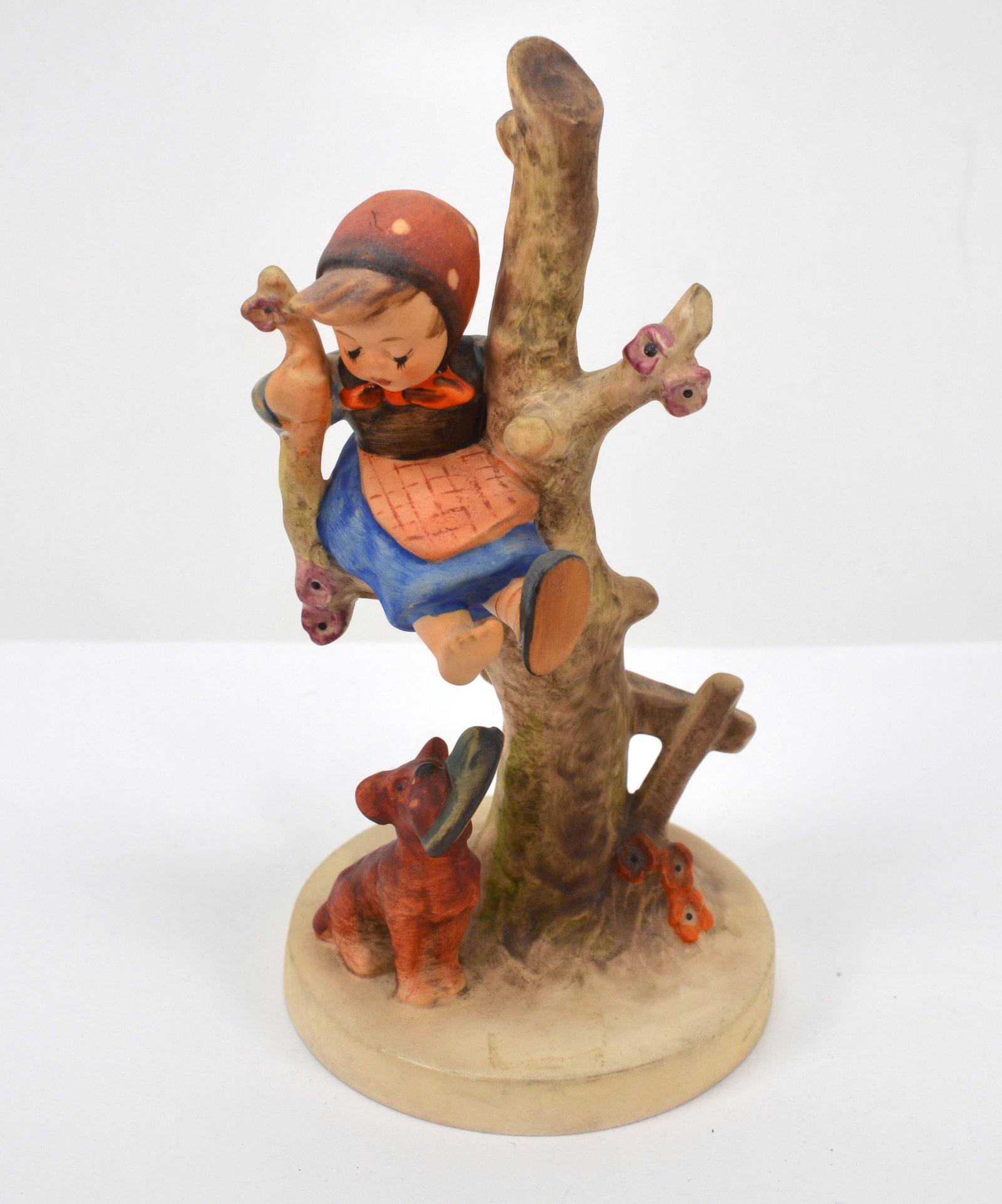 Out of Danger Hummel Figurine 56/B: Very sweet figurine. A young girl is in a tree escaping a dog that has taken one of her slippers. 7 in high NB BS34 wrapped in bubble S