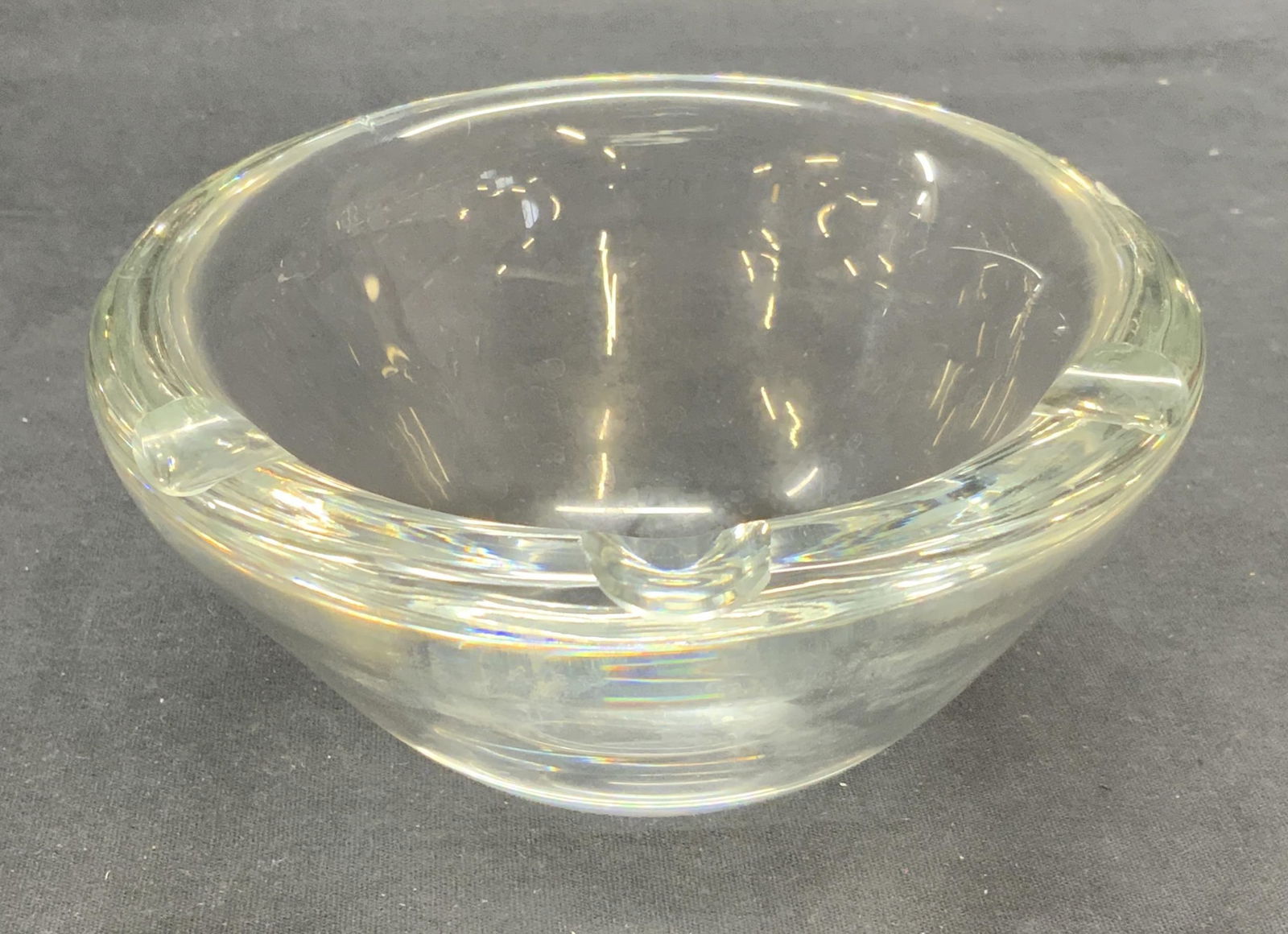ORREFORS Heavy Cut Crystal Bowl: ORREFORS heavy cut crystal bowl with 3 indented scalloped sections on rim. Signed to underside. Thick walled crystal, piece has weight. Measures approx. 6 x 3 inches. Some scratching observed. ORREFOR