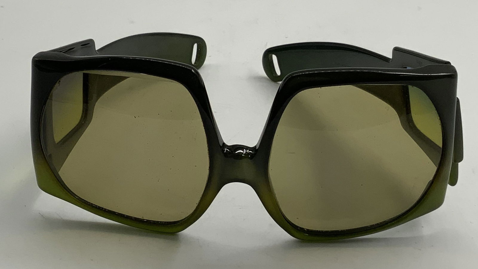 Vintage Christian Dior Austria XL Green Sunglasses: Vintage Christian Dior dark green to light green ombre acrylic frame sunglasses. Signed on arm. Made in Austria. Measure approx. 5.5 inches wide, arm approx. 5 inches long. Some scratching and small c