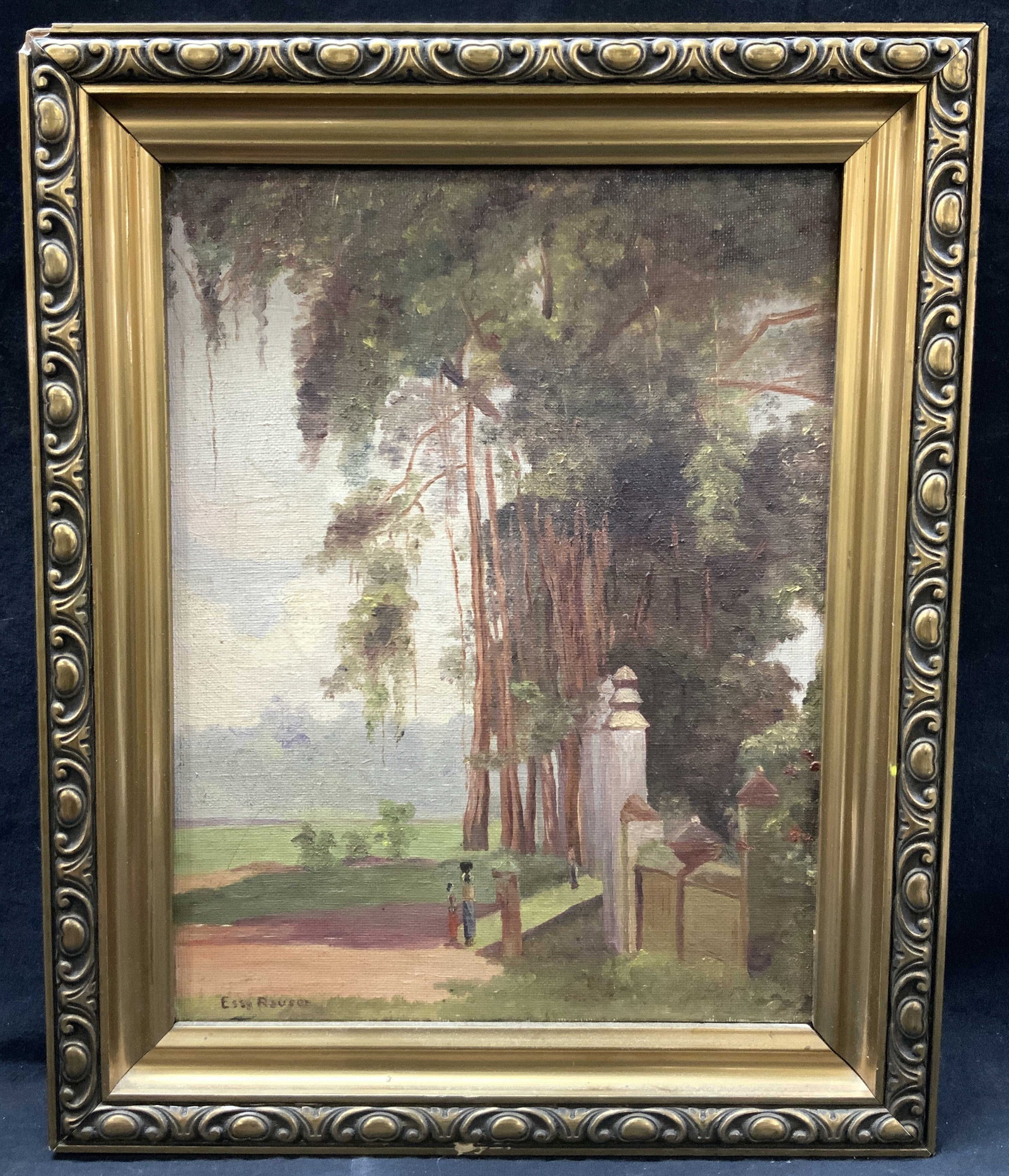 Else Reuser Sgd Village Gate Acrylic Painting: Signed in lower left corner, reads Else Reuser. Subject depicts an Indonesian village gate with tall over hanging trees, Framed in ornate gold leafed wooden frame Approximately 16.5 x 13.5 inches wind
