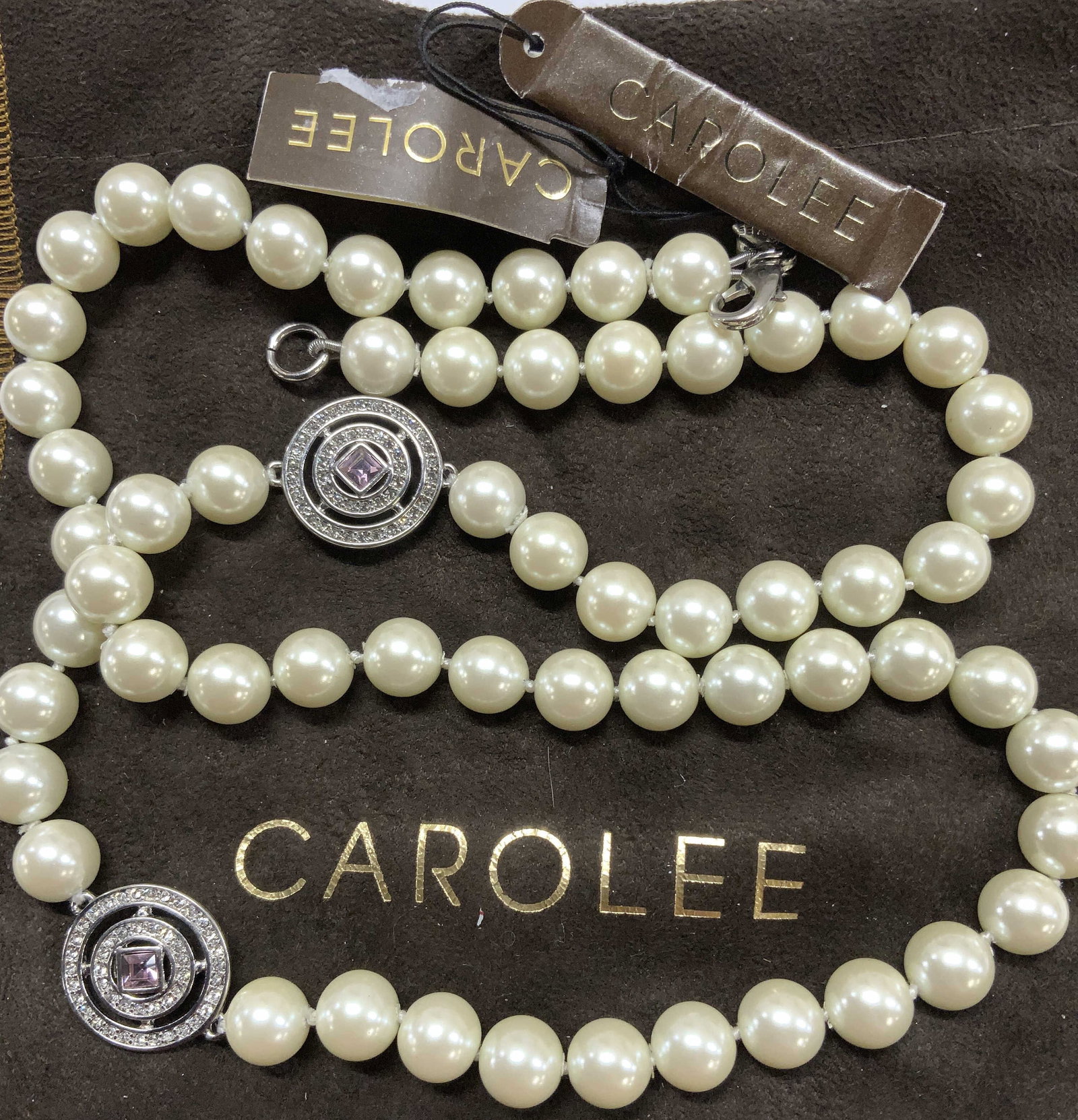CAROLEE signed Costume Pearl Necklace, 2 NWT: Carolee faux pearl necklace with 2 round crystal ornament accents. New with tags .lobster clasp, necklace drop is 11 in. Comes with a brown Carolee dust bag., Faux pearl necklace. Luxury Carolee costu