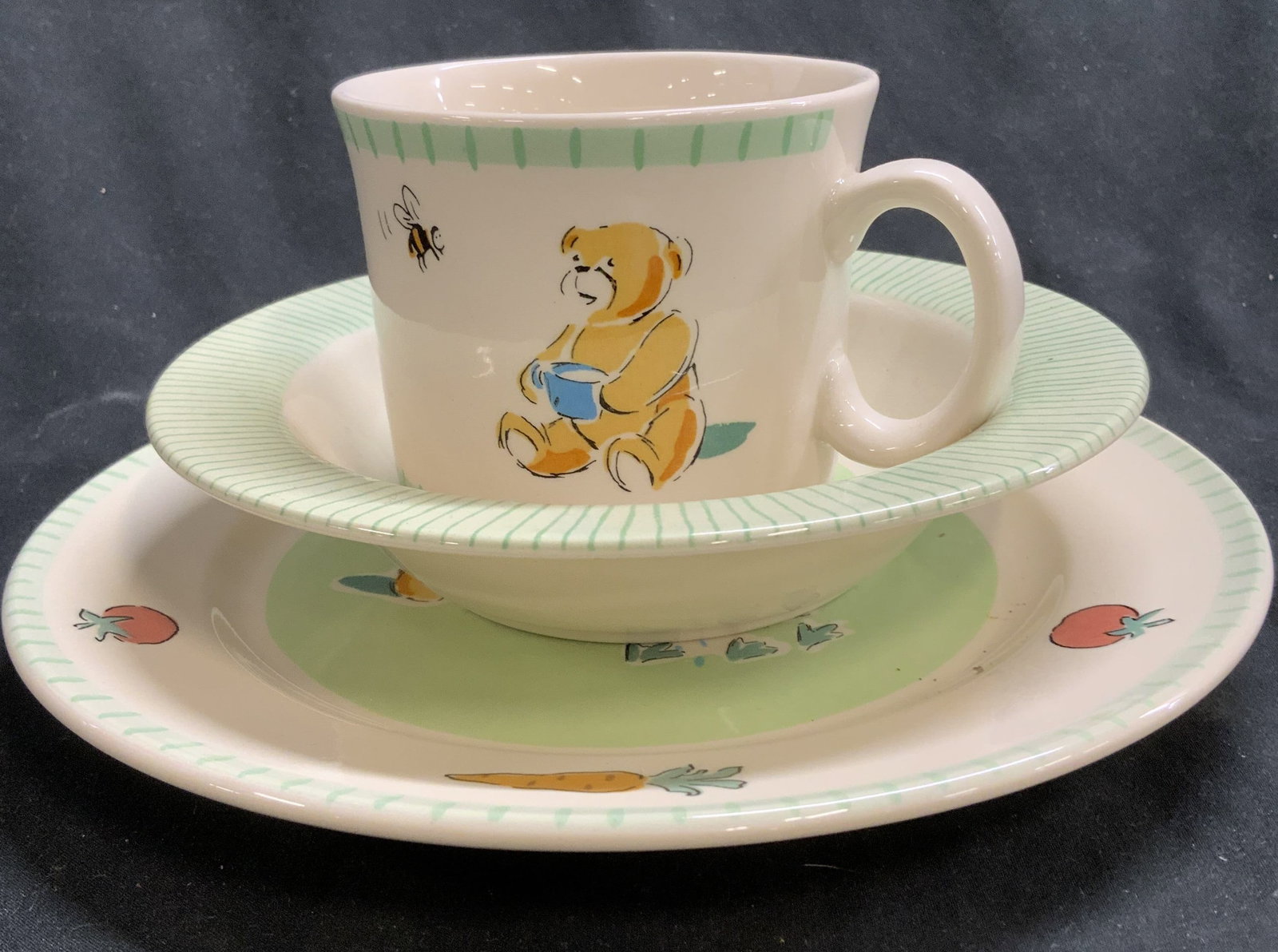 IKEA 3 Pc Teddy Bear Porcelain Childs Tableware: IKEA childs plate, bowl and mug with teddy bear , bumble bee decor on porcelain. Plate measures 8.25 in. Bowl measures 1.5 in ht. x 6.5 in. Wide. Light wear.