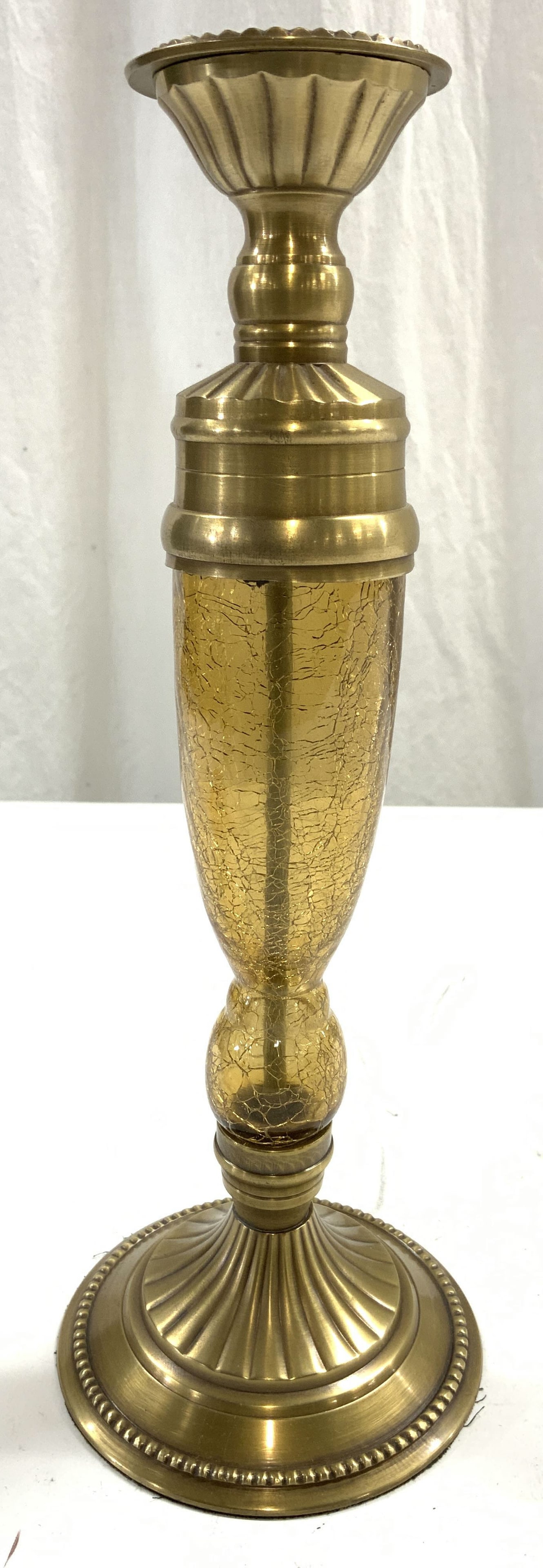 Glass & Gilt Metal Candlestick: Candlestick appears to be gilt metal, possibly gilt bronze, possibly brass. Candlestick had glass center with crackled detail. Gilt metal has fluted and beaded areas. Base has circular shape. Piece me