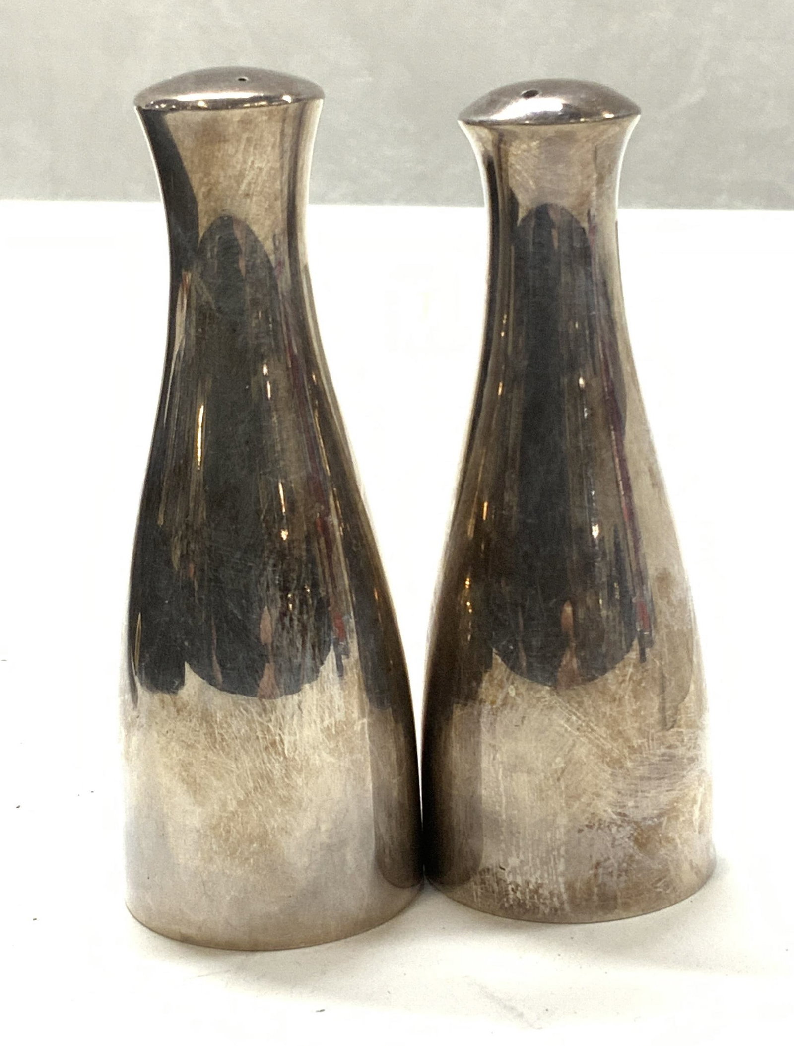 Sterling Silver Salt & Pepper Shaker, Denmark: Modern style Sterling silver salt and pepper shaker. Tests positive for sterling with PuriTEST kit. Marked Denmark . 3.75 in. tall , approx 1.5 in. Wide . Each has a stopper..3.18 ozt. product manufac