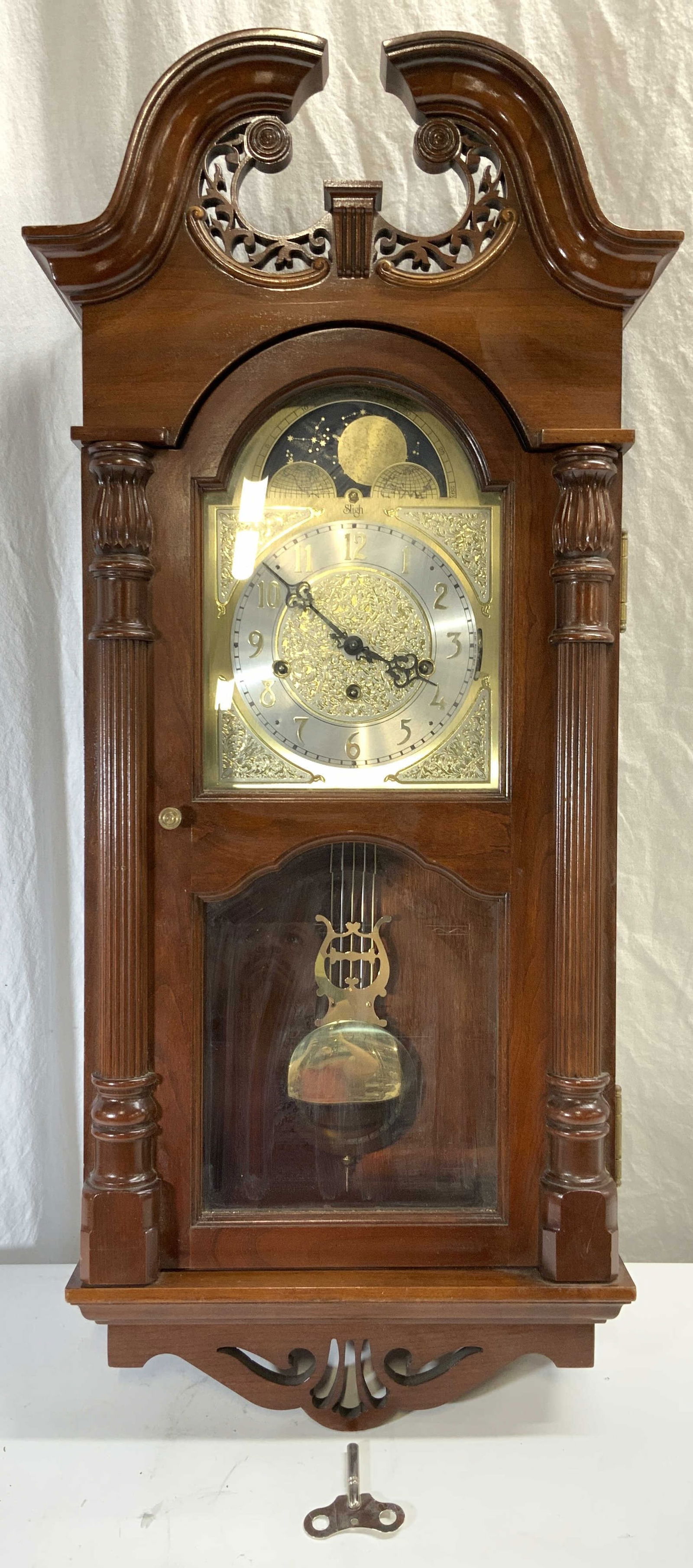 SLIGH FRANZ HERMLE Vtg Carved Mahogany Wall Clock: Clock face reads SLIGH backside of interior inscribed FRANZ HERMLE MADE IN GERMANY. Model Number 0772-2-CC. Reg number 464-052-04. Movement: 502-2963. Dial: 538-0042. Clock is brown toned and wooden,