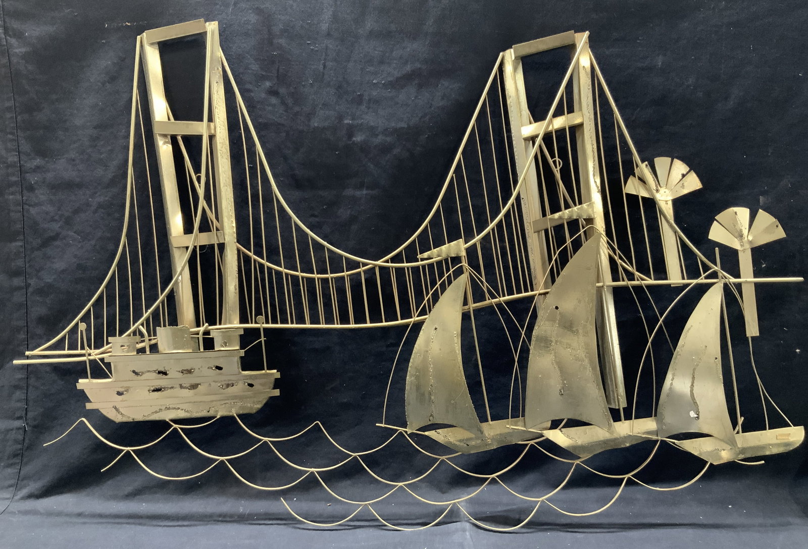 Hara Sgd Welded Metal Bridge Wall Sculpture: Signed on lower corner Hara. Curtis Jere Inspired bridge wall sculpture with 3d elements of the bridge and ships and sail boats on the water Approx 28 inches tall and 42 inches long. Moderate surface 