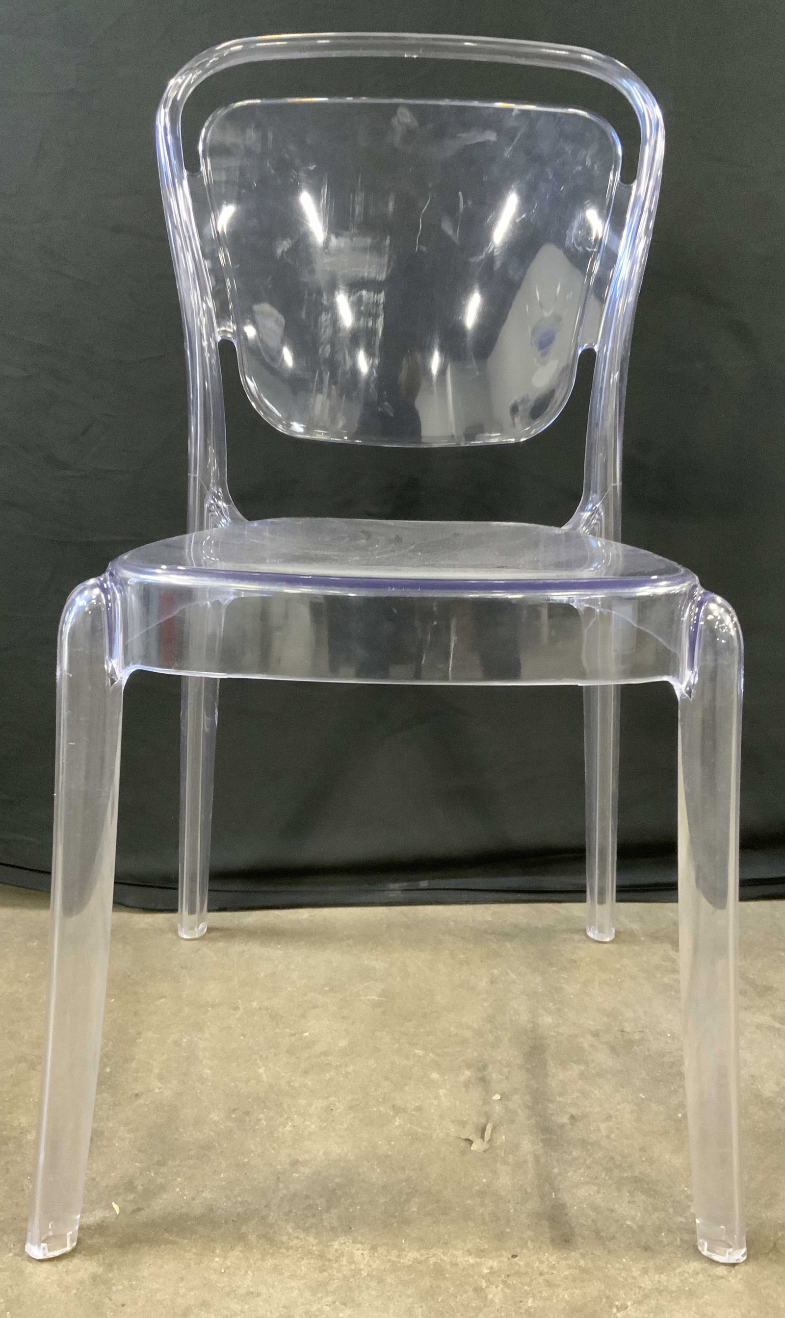 Modway EEI-1070-CLR Entreat MCM Ghost Chair: Chair appears to be Modway EEI-1070-CLR Entreat. No marking present. Chair is mid century modern. Chair is clear. Large pierced shapes within backrest. Chair has legs. Side chair measures approximatel