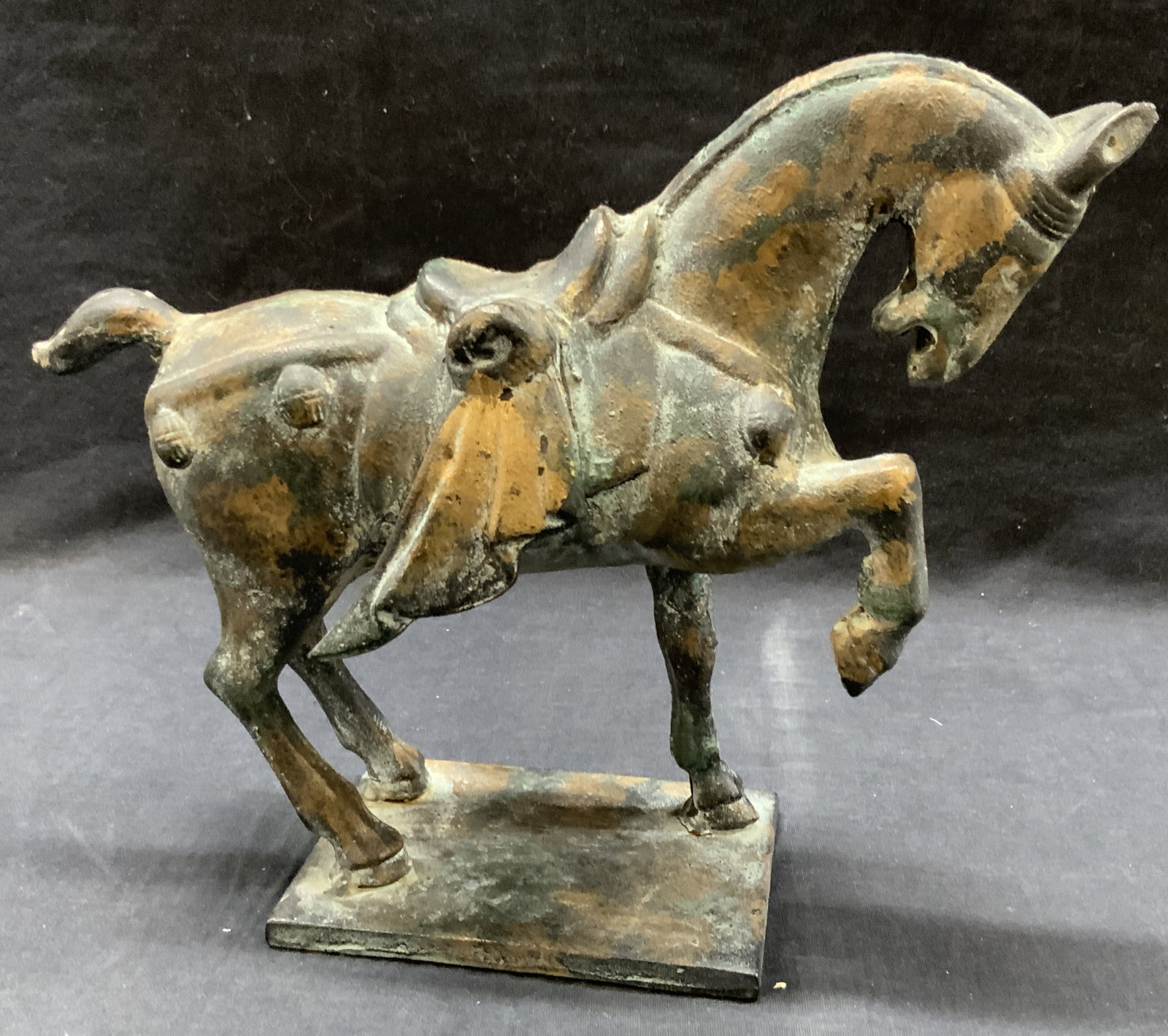 Iron Crafted Tang Style Asian Horse Figure: Iron made horse Figural vintage replica of Chinese tang dynasty Hose figure with gold paint throughout. Approx 9.5 inches tall and 11 inches long. Moderate weight and wearing to metal Iron figure, hor