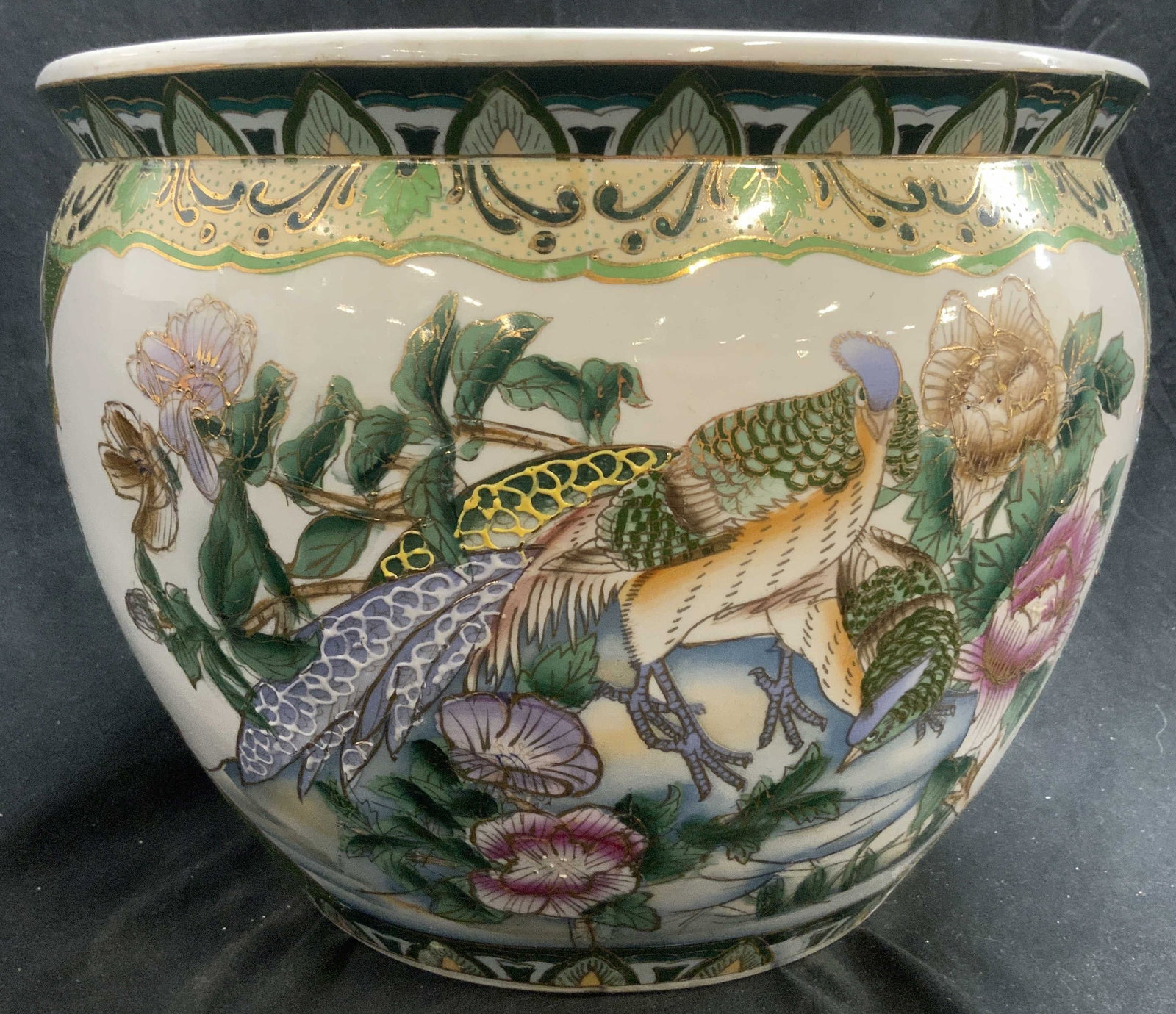 Hand Painted Asian Porcelain Planter Vessel: Planter is porcelain. Piece has hand painted elements of pheasants, floral & leaf detail. Piece also has gilt detail. Rim has floral and leaf detail. Interior has fish detail. Vessel measures approxim