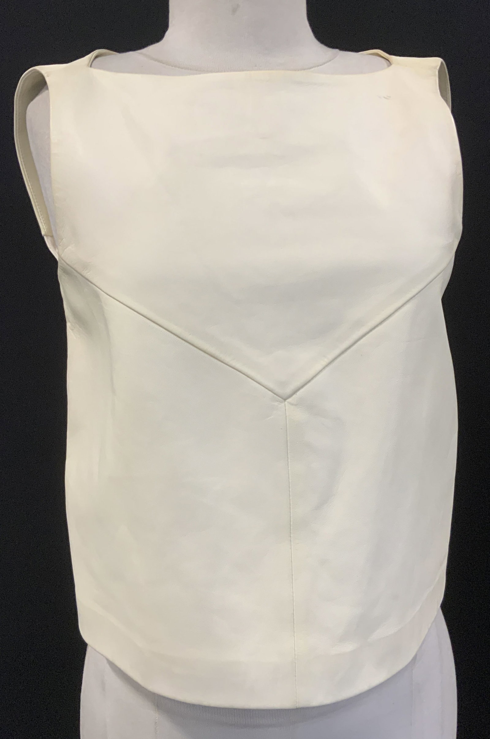 BALENCIAGA Sleeveless Lambskin Leather Shirt France: Cream toned BALENCIAGA Sleeveless top. Made in France., 50% lambskin leather, 50% cotton. Unlined. Size 36 , backside zipper. Mild pen mark near shoulder. Luxury top, BALENCIAGA wearables, luxury vint