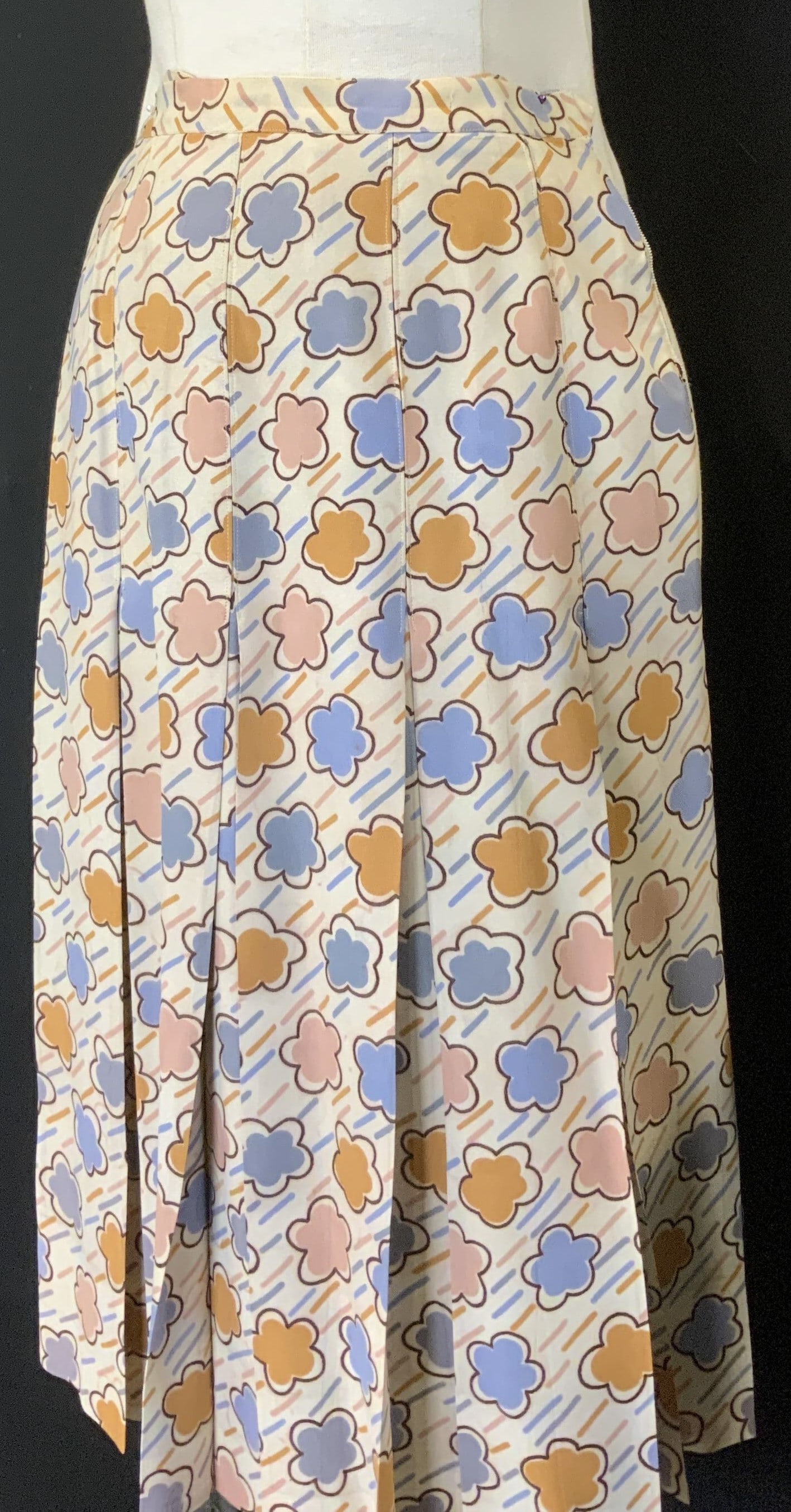YVES Saint Laurent Mid Century Skirt France: Vintage Saint Laurent Rive Gauche pleated flower skirt . Made in France. Vintage Size 36/ 22 in. Waist side zipper. 26.5 in. Long . Label attached, dry clean. Muted mid century pink, blue, and orange 