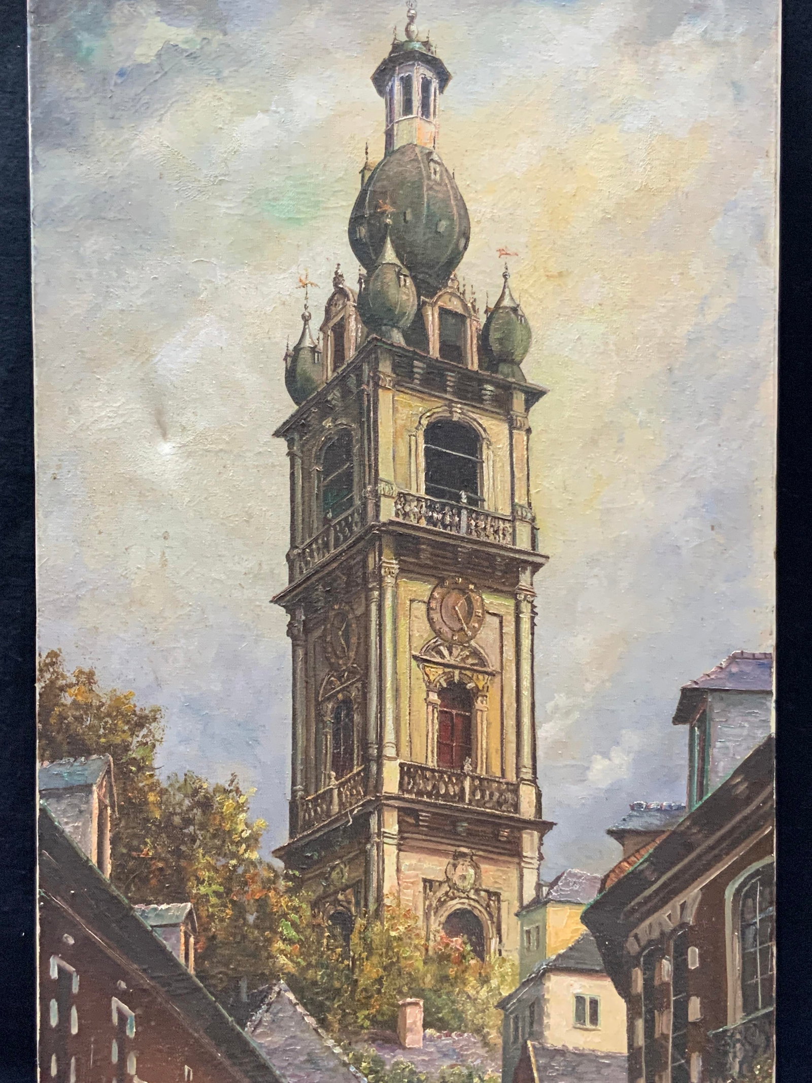 Signed Vintage Belgium Belfry Of Mons Oil Painting: Signed on lower right corner illegible. Depicts a street view in Belgium looking at the Belfry of Mons spire. No frame. Approx 32 x 16 inches. Moderate wearing to edges and corners of canvas with mino