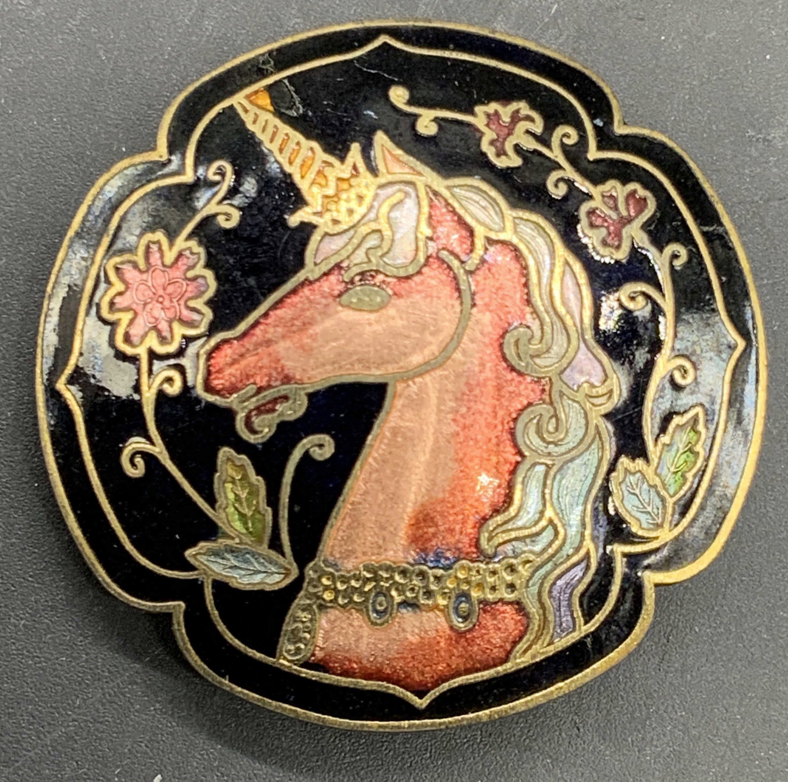 Multicolored Enameled Unicorn Motif Shoe Clip: A gold tone metal multicolored enameled unicorn motif shoe clip / jewelry accessory. Measures approx. 1.5L x 1.5W in. Some discoloration and surface wear present. jewelry, accessories, Fashion Jewelry