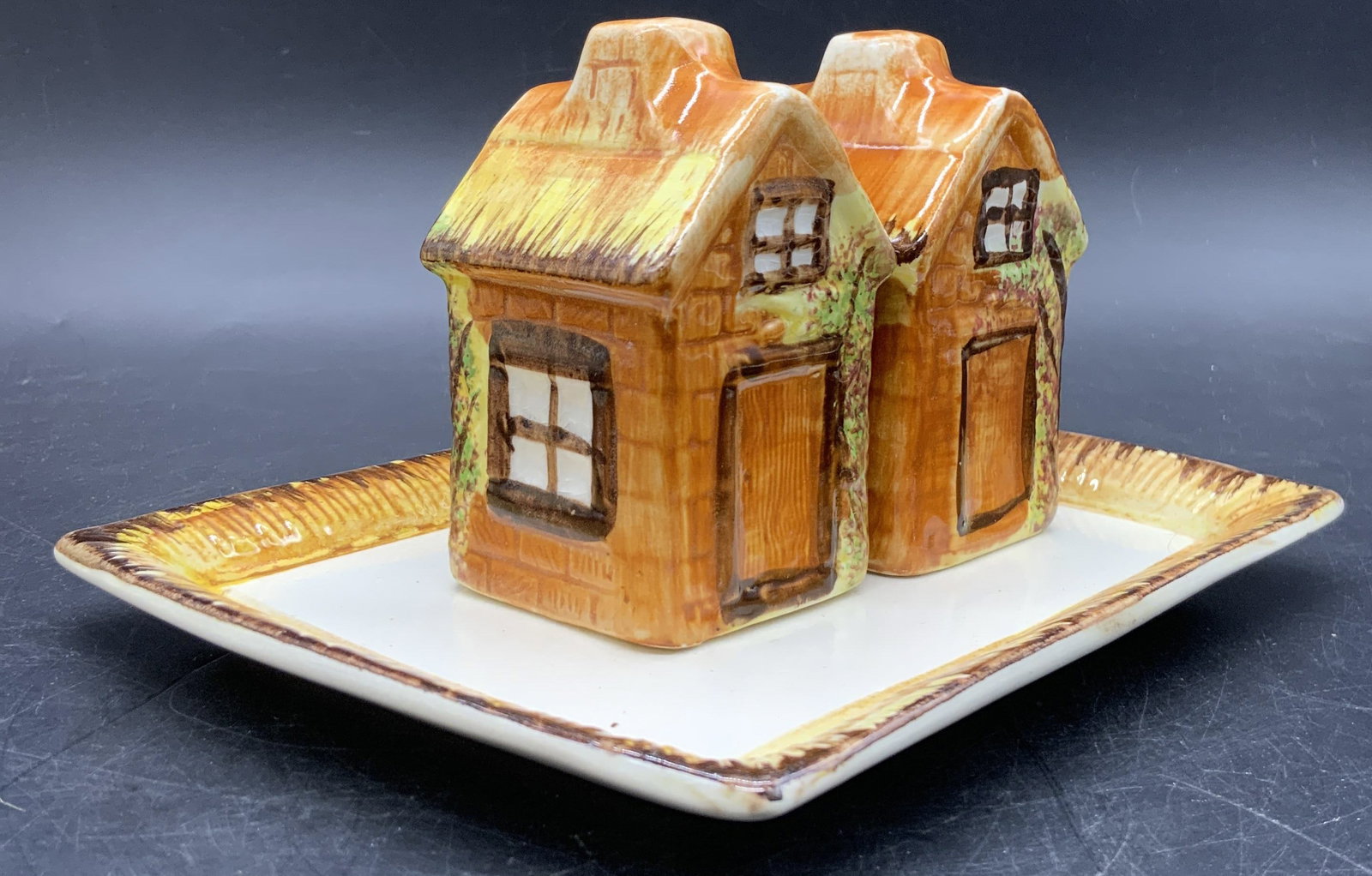 3 PRICE Salt & Pepper Shakes W Under Plate England: Set three vintage hand painted cottage ware salt & pepper shakers with an under plate. The plate is stamped PRICE BROS MADE IN ENGLAND on the underside. Stamp is worn. Pieces are crafted from ceramic 