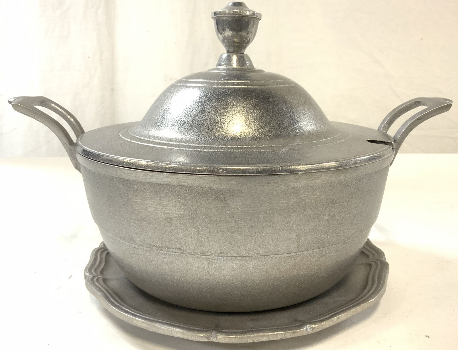 WILTON Mount Joy PA Vintage Pewter Pot & Plate: Undersides are inscribed WILTON MOUNT JOY PA. Each piece is silver toned pewter. Pot has handles and includes lid. Plate has slightly scalloped edges. Lidded pot measures approximately 12.5 inches wid