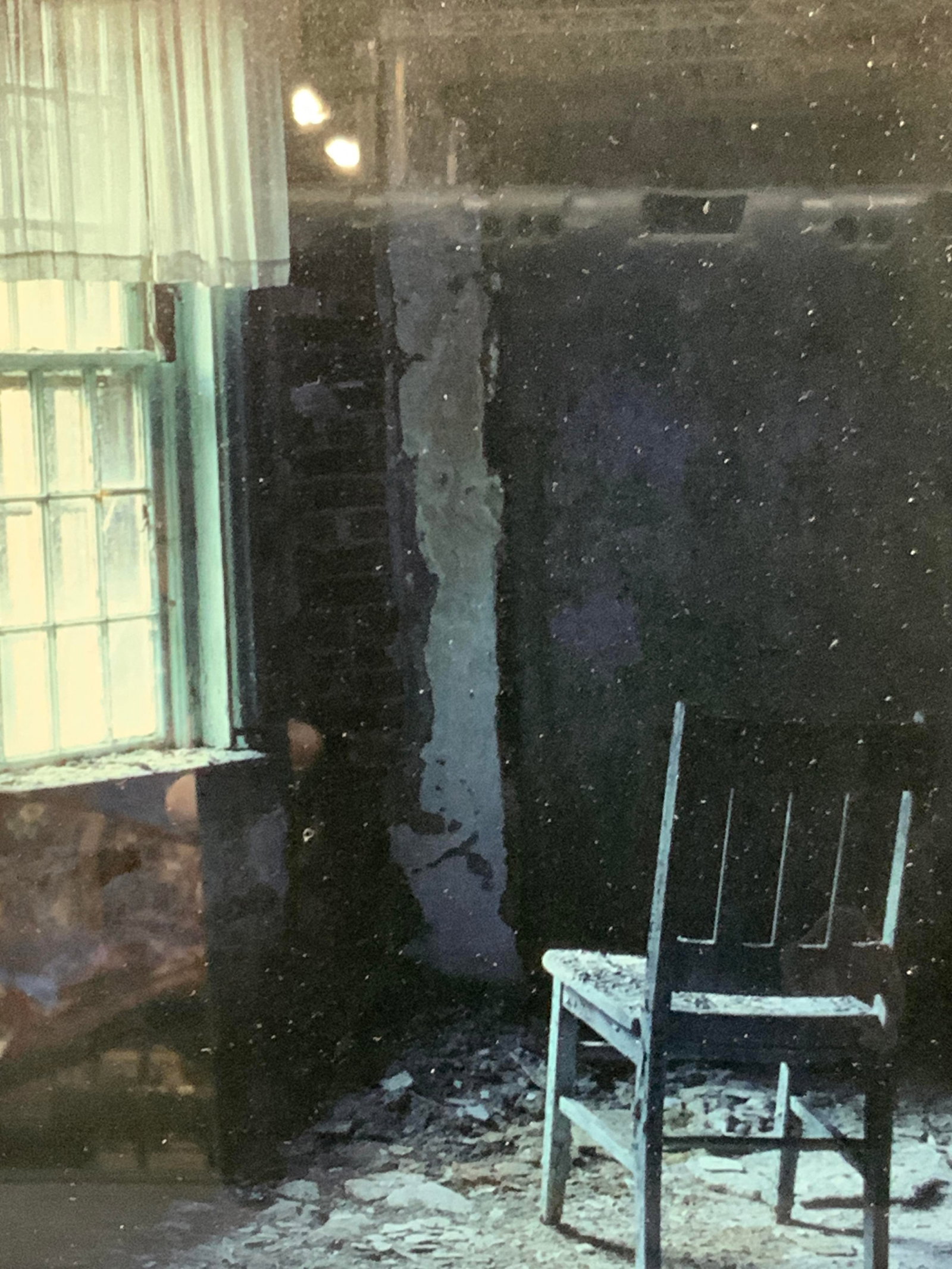Framed Photography Abandoned House: Framed photograph of a lone chair in an interior of an abandoned house. Framed in a black wooden frame. Approx 10.75 x 8 inches window measures 8,75 x 5.25 inches Minor wearing to frame. Photography, 