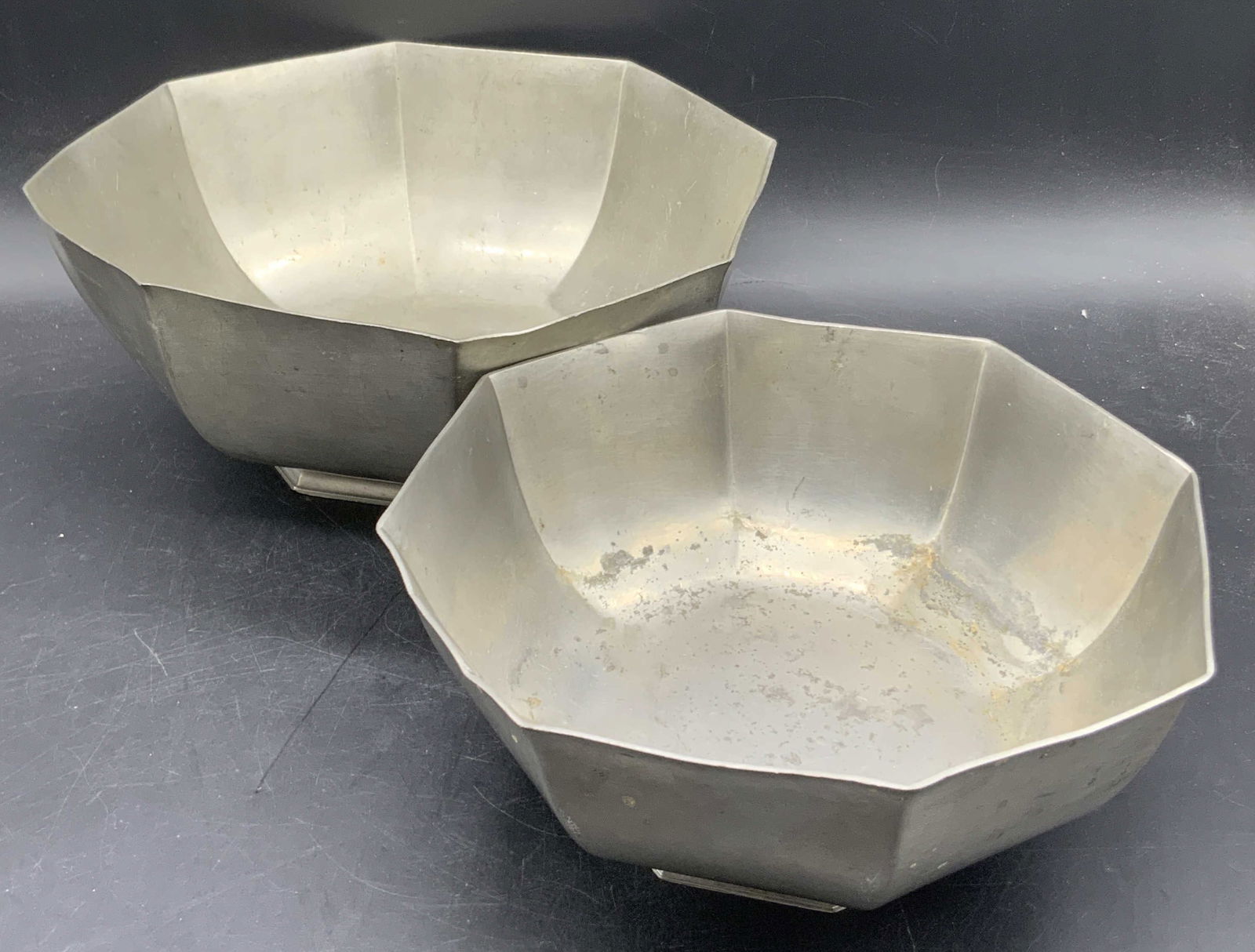 Set 2 Vintage GORHAM Pewter Bowls PH6 & PH7: Set two vintage pewter bowls. Stamped GORHAM PEWTER. One stamped PH6 and the other is stamped PH7. Larger bowl measures approx. 4.25H x 10Win. Some denting, discoloration, and surface wear present. Ho
