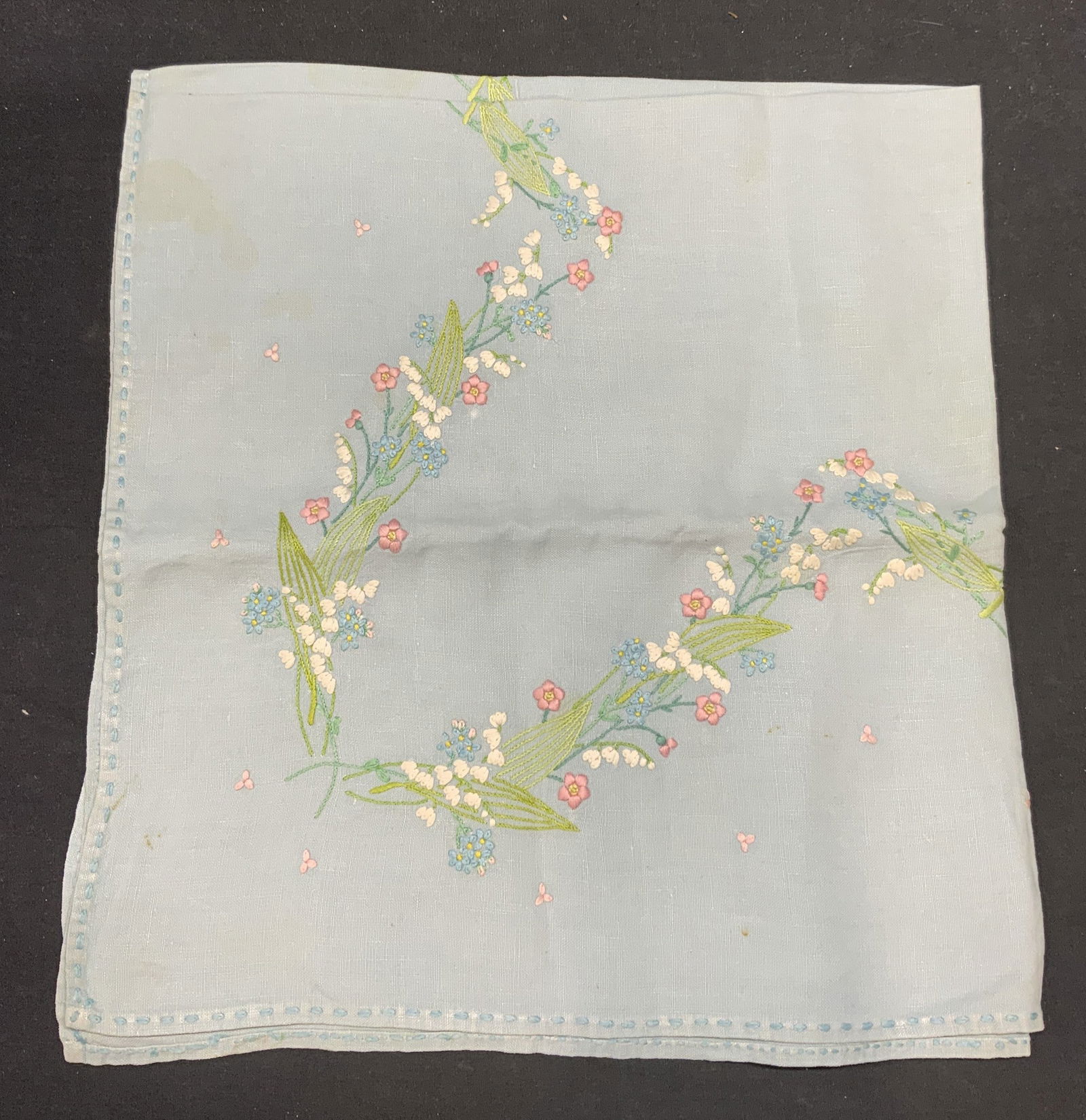 Vintage Blue Cotton Embroidered Floral Tablecloth: Vintage blue cotton tablecloth with floral embroidery. Measures approx. 32 x 30.5 inches. Some blemishes observed. Tablecloth, cotton tablecloth, blue tablecloth, vintage tablecloth, floral tablecloth