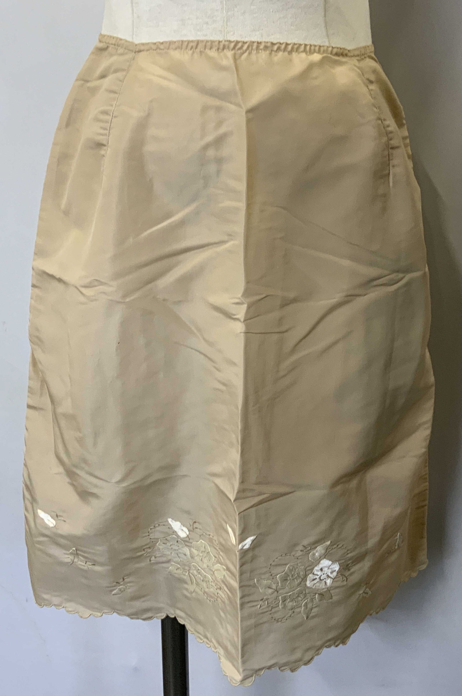 Eve Jr Eve Stillman Tan Embroidered Slip Skirt: Vintage Eve Jr. Eve Stillman tan hand embroidered slip skirt with floral motif. Measures approx. 13.25 inches across waist. Material feels synthetic. Some wear to material consistent with exposure. Ev