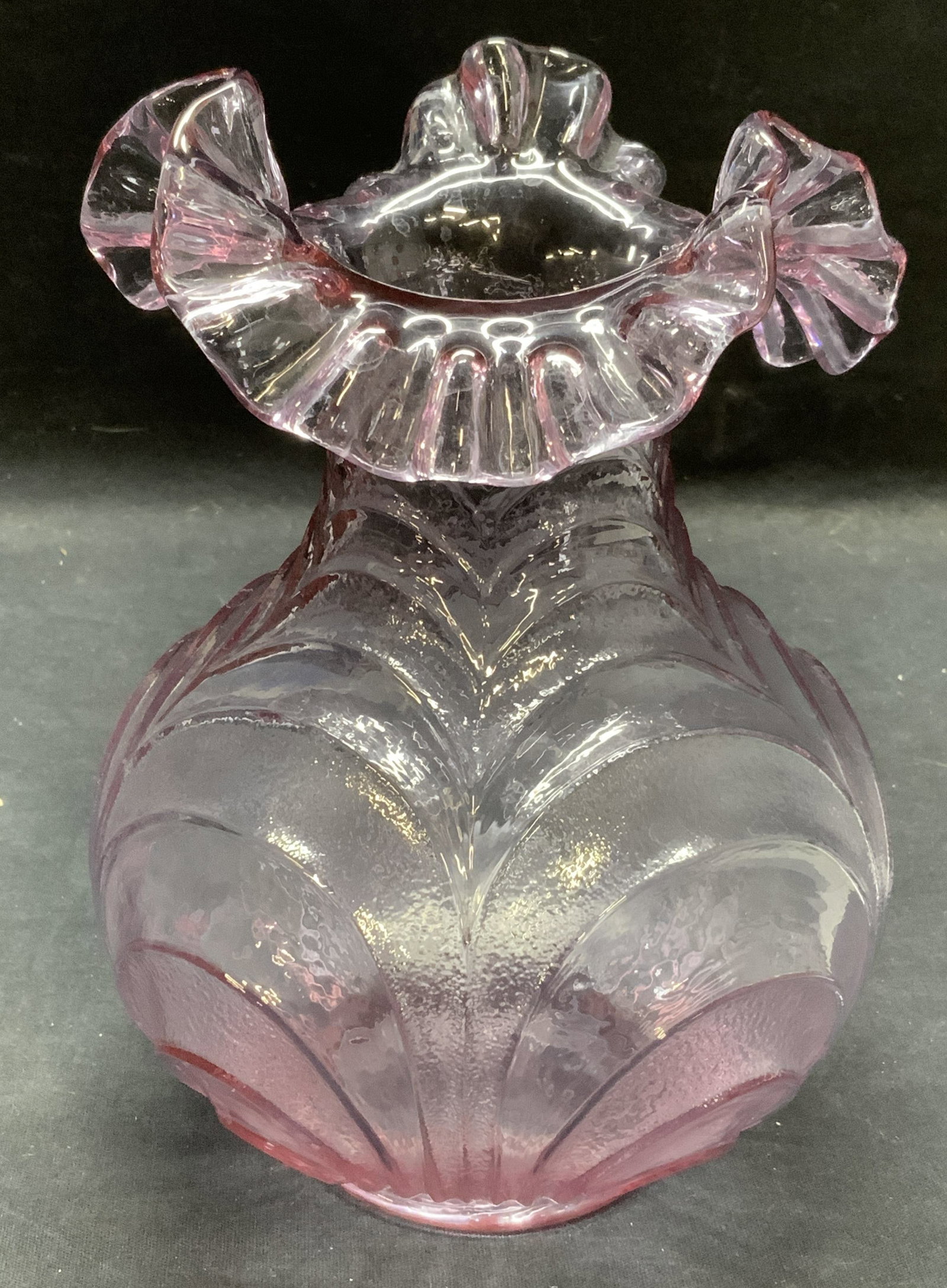 Hand Blown Purple Art Glass Ruffle Rim Vase: Hand blown art glass vase with ruffle rim and ribbed body. Measures approx. 6 x 7.75 inches. Some scratching observed. Art glass, art glass vase, glass vase, purple vase, ribbed vase, ruffle vase, han