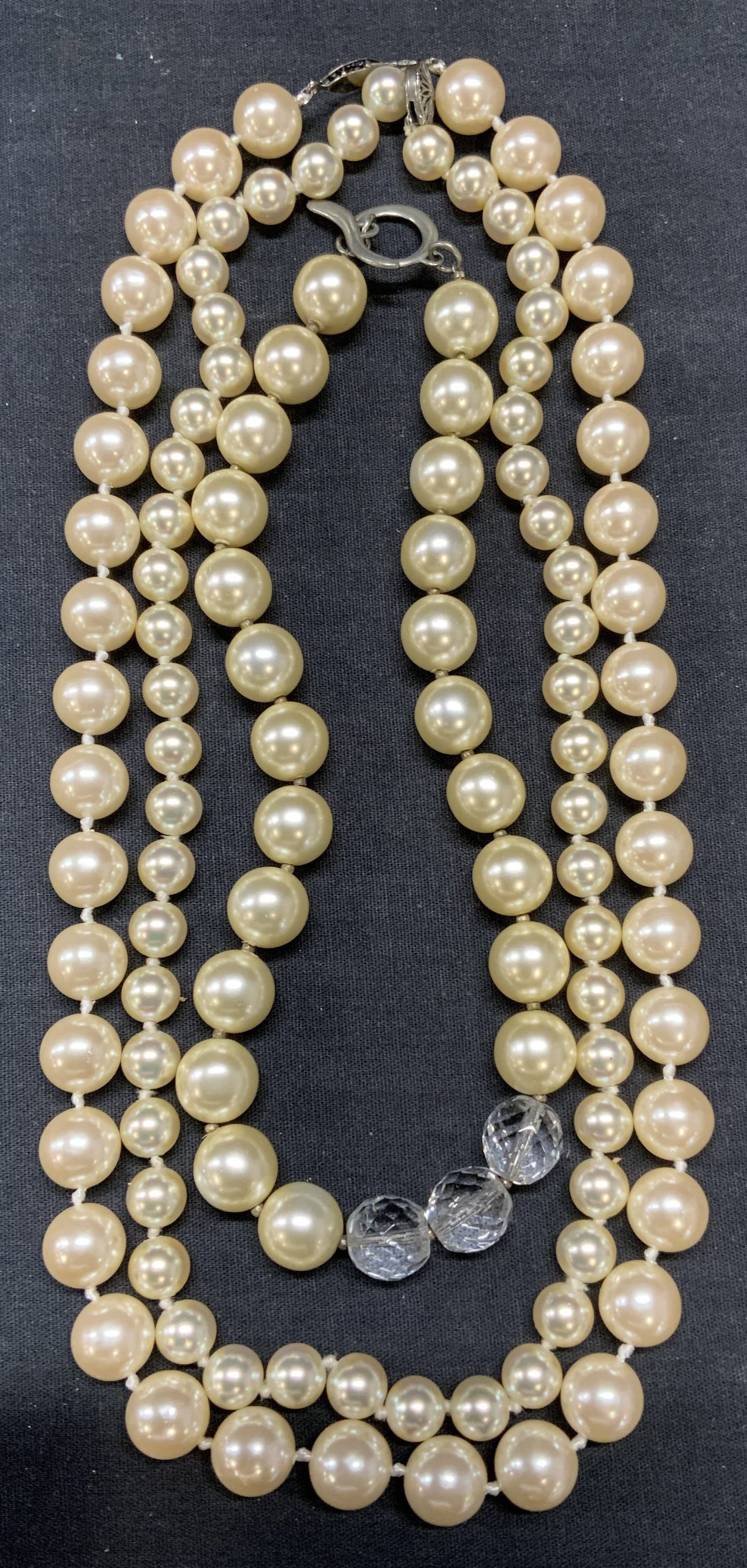 Lot 3 Faux Pearl & Crystal Necklaces: Lot of 3 jewelry pieces. 3 faux pearl beaded necklace. 1 with crystal bead decoration and 1 with sterling silver clasp. Longest necklace drop length approx. 11.5 inches. All pieces have some surface w