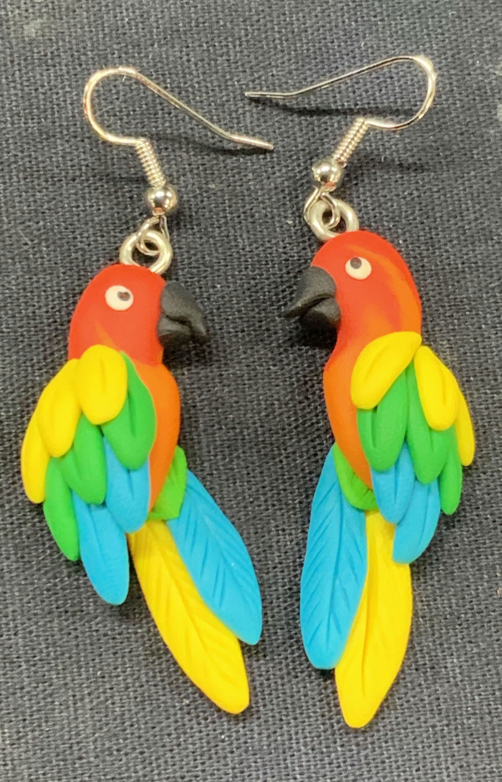 Pr Clay Crafted Parrot Earrings: Pair of clay crafted earrings made of look like parrots in vibrant colors approx 2.25 inches long Minor to little wearing Clay earrings, bird earrings, earrings, bird decor, jewelry, clay crafted jewe