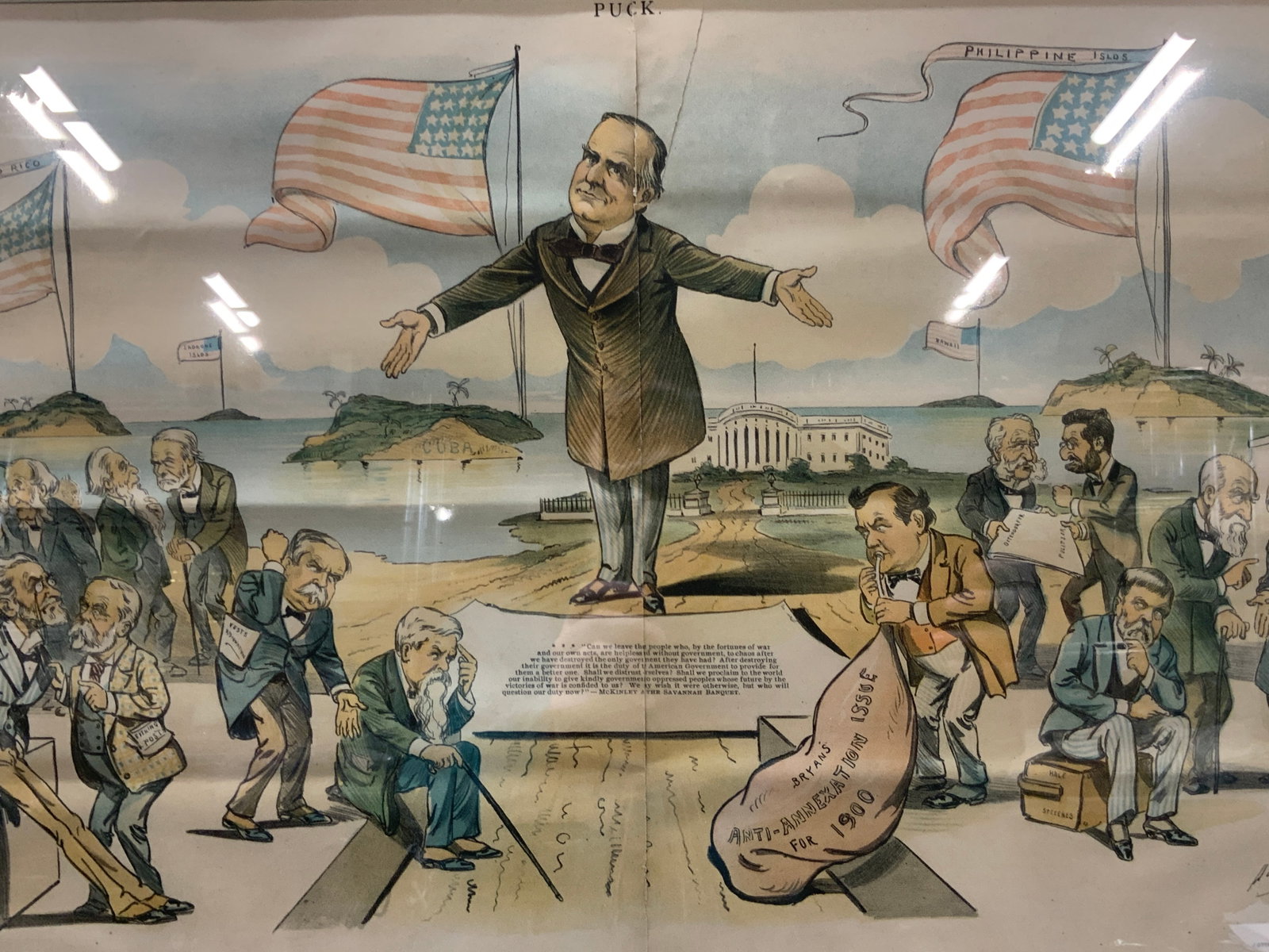 Puck 1899 Who Will Halt It Down Political Cartoon: Marked Puck, copyright 1899 Reads Who will halt it down? Depicting McKinley standing behind a quote of himself with other political members discussing the meaning behind the quote and someone blowing 