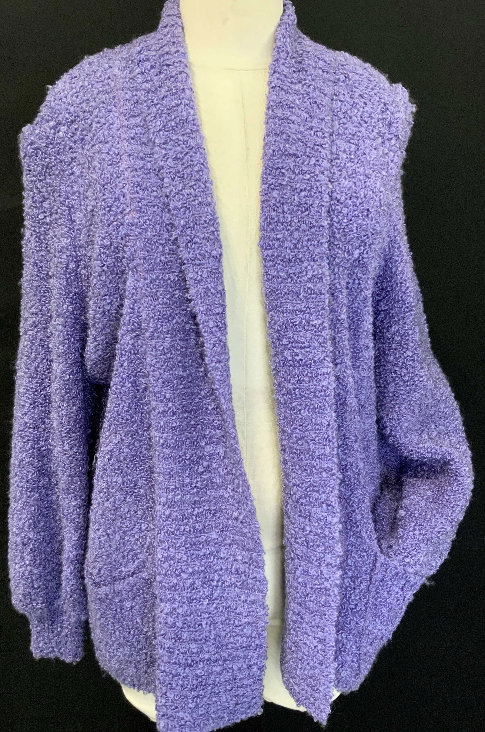 Vintage Adele Joyce Woven Cardigan: Adele Joyce Woven material in a purple tone. Sleeve measure 15 inches long, torso measures 25 inches down and chest measures 23 inches across, complete with front pockets and tapered sleeves.Minor wea