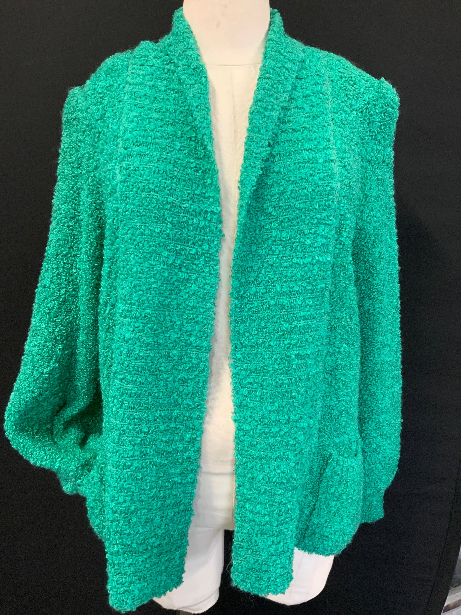 Vintage Adele Joyce Fleece Cardigan: Adele Joyce Woven material in a green tone. Sleeve measure 15 inches long, torso measures 25 inches down and chest measures 23 inches across, complete with front pockets and tapered sleeves.Minor wear