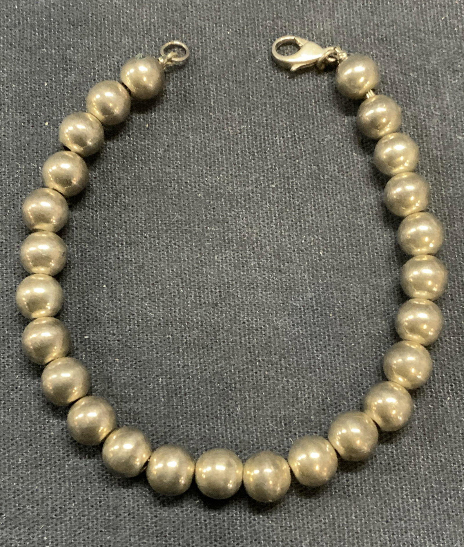 Vintage Sterling Silver Beaded Bracelet: Vintage sterling silver round beaded bracelet. Tests for sterling using PuriTEST kit. Measures approx. 6.75 inches long. Total weight .29 ozt. Some scratching observed. Estate jewelry, fine jewelry, c
