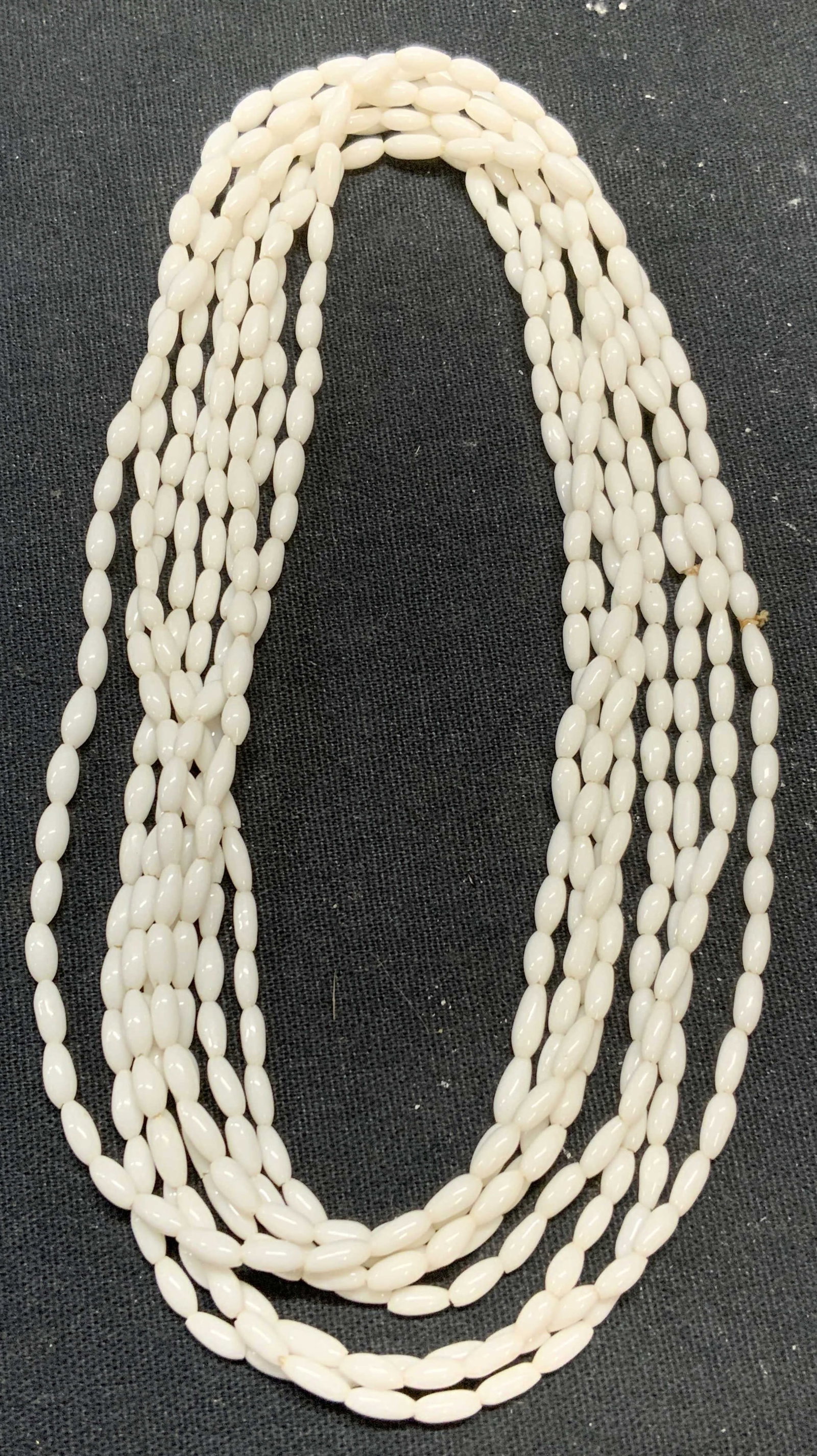 White Seed Beaded Rope Necklace, 49 In: White seed beaded rope necklace. Drop length approx. 49 inches. Some scratching observed. Estate jewelry, costume jewelry, cocktail jewelry, fashion jewelry, accessories, fashion accessories, wearable