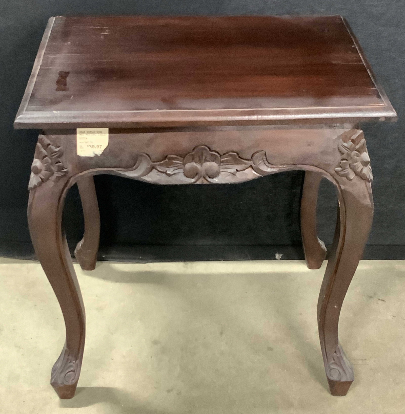 IMAX WORLD WIDE Carved Wood Side Table: A IMAX WORLD-WIDE carved wood side table with cabriole style legs. Measures approx. 17H x 14.25D x 17.75W in. Tag to reverse reads IMAX WORLD-WIDE. Some wobble to piece. Some chipping, scratches, and 