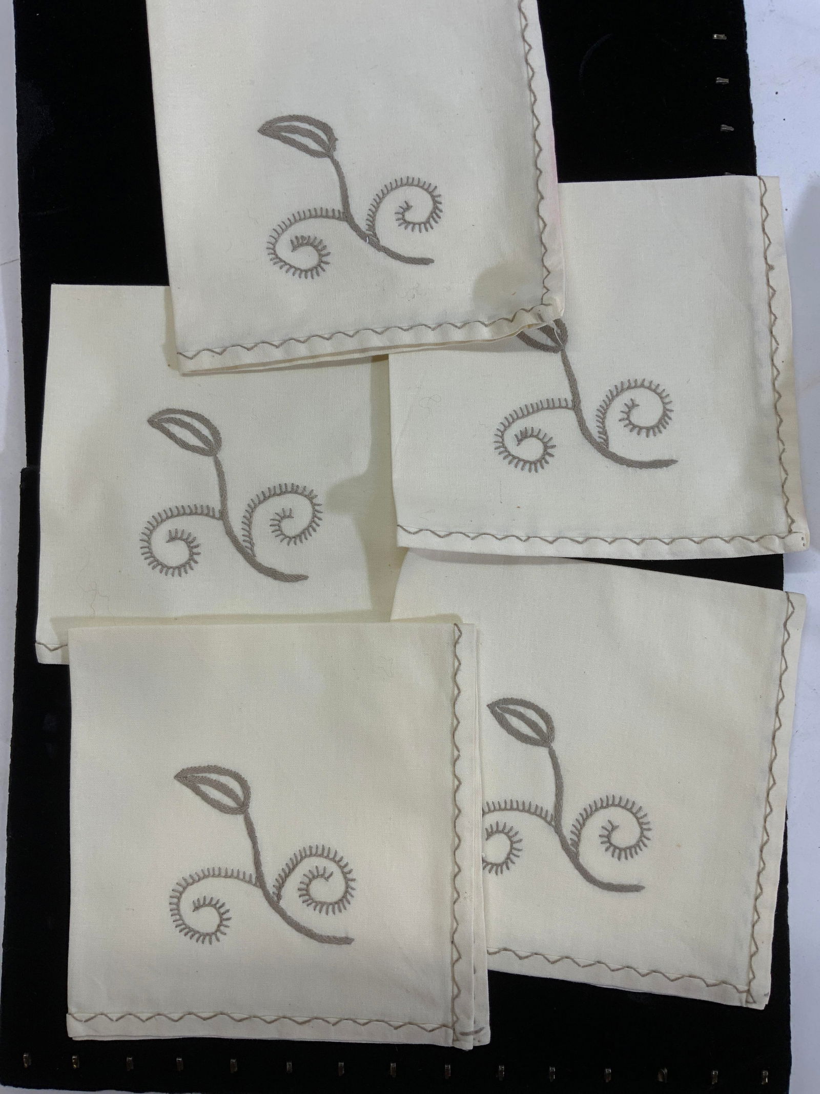 Set 5 Hand Embroidered Cream Linen Napkins: Pressed vintage linen napkins in cream with taupe embroidery. Hand embroidered flower deco and decorative stitch along border., 15.5 x 15.5 in., A few have a minor blemish along rim ( see photo the on