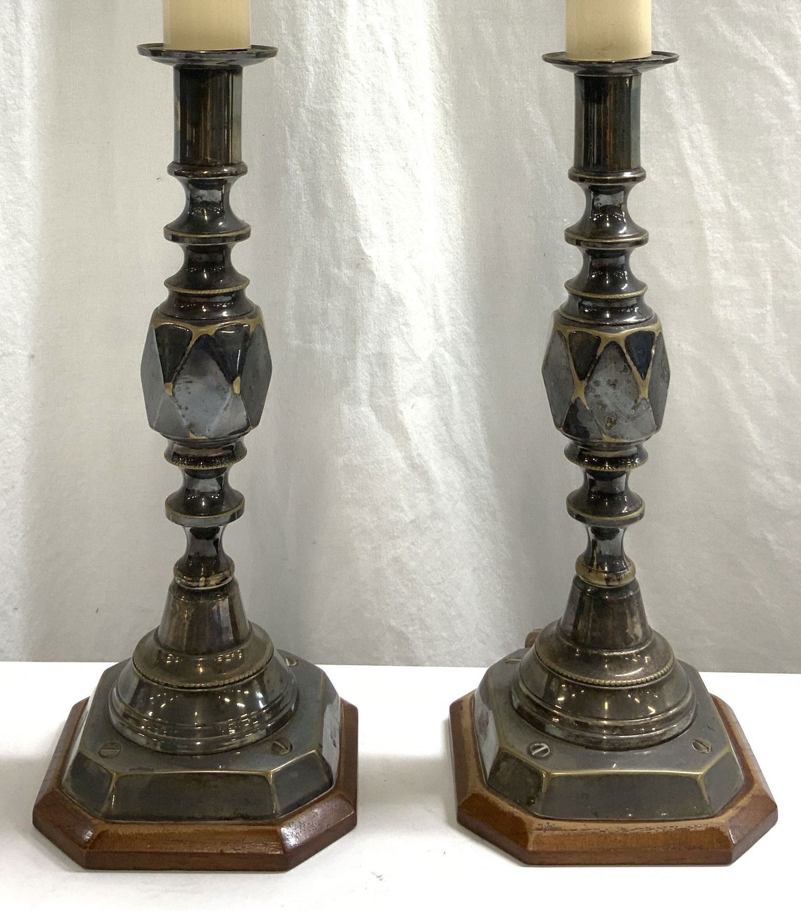 Sterling Silver DIAMOND PRINCESS Candlestick Lamps: Each Lamp tests positive for sterling silver with PURITEST tester. Each is inscribed THE DIAMOND PRINCESS ENGLISH RP 385856. Lot includes 2 candlestick lamps. Each affixed to brown toned wooden bases.