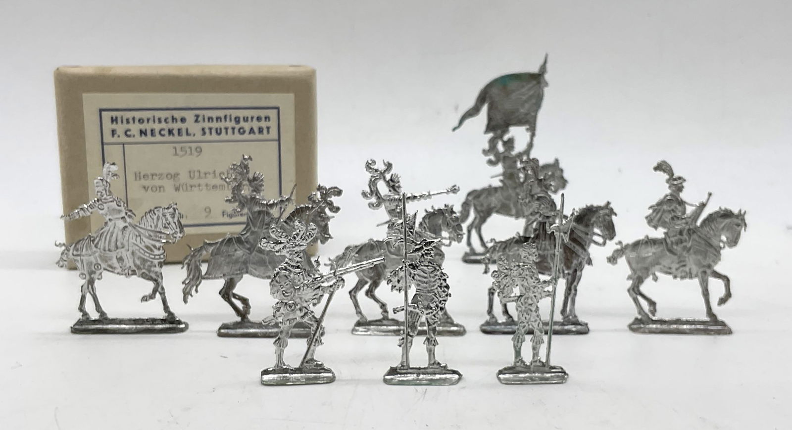 Vintage FC Neckel 9 Flat Tin Toy Soldiers. IB: Vintage FC Neckel 9 Flat Tin Toy Soldiers Historische Zinnfiguren HERZOG ULRICH VON WURTTEMBERG 1519. In Box. Box measures approx 3H x 3.5W in. historic Tin Figures. F.C. NECKEL figurines, flat Tin so